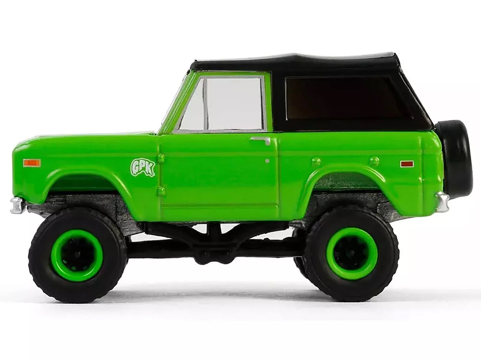 Left. Greenlight - 1969 Ford Bronco "Garbage Pail Kids: Super Snotty" Green with Black Top "San Diego Comic-Con 2024 Exclusive" 1/64 - Green With Black Top.