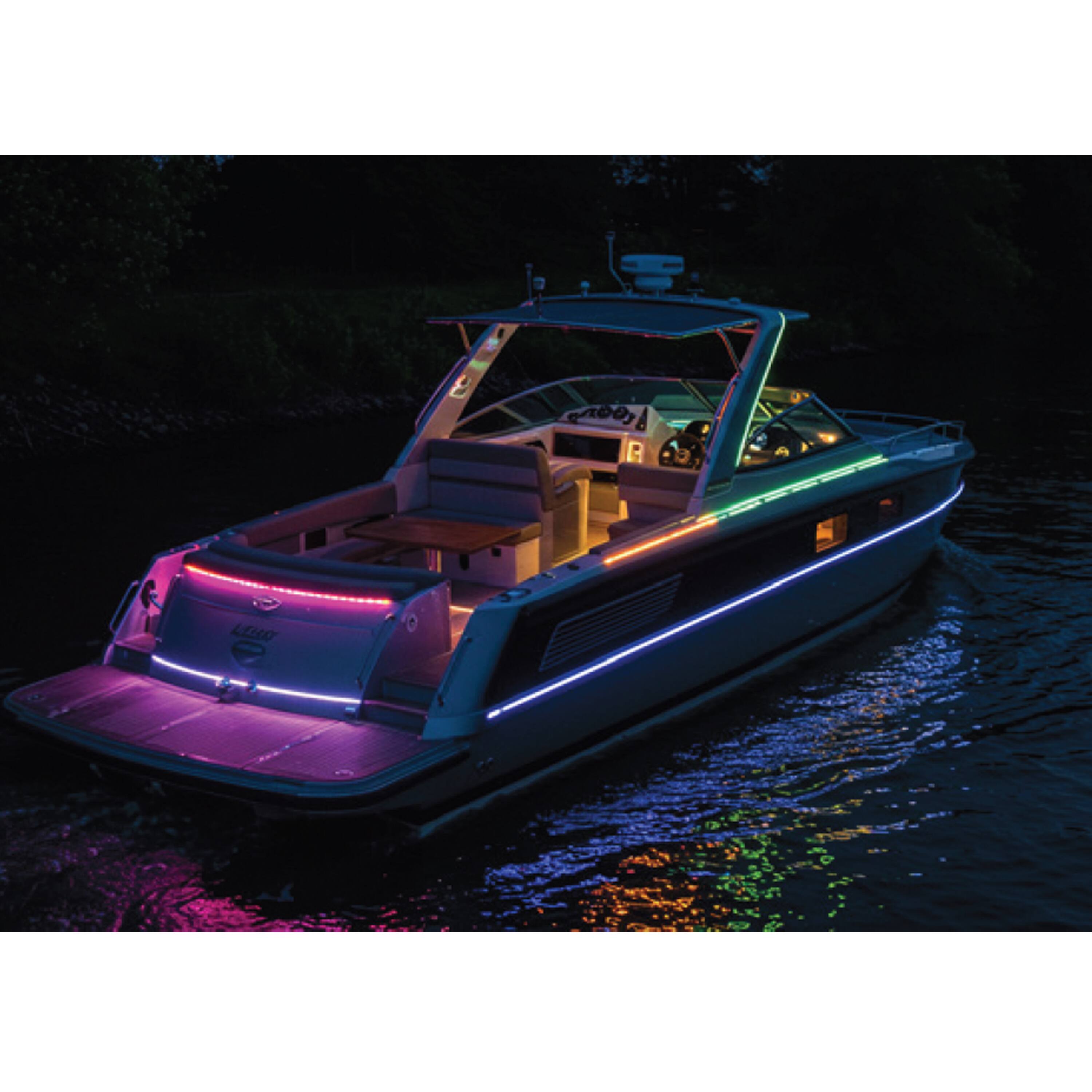 A boat is floating on the water at night.