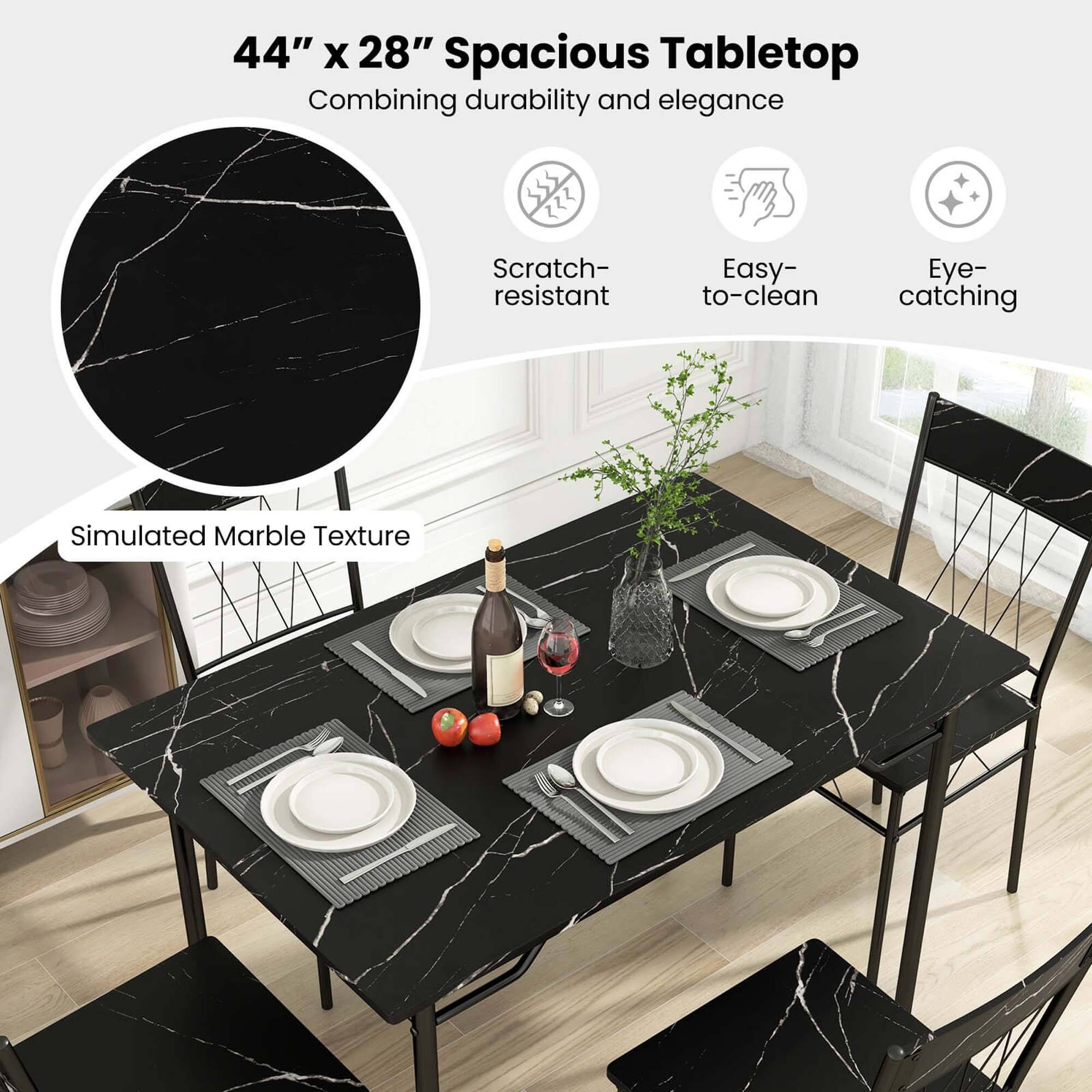 The image features a black dining table with a marble-like texture, accompanied by four chairs. The table is set with four place settings, including plates, forks, knives, and spoons. The table is also adorned with a vase and a potted plant, adding to its overall aesthetic appeal. The table is described as spacious, durable, and easy to clean, making it a practical and stylish choice for a dining area.