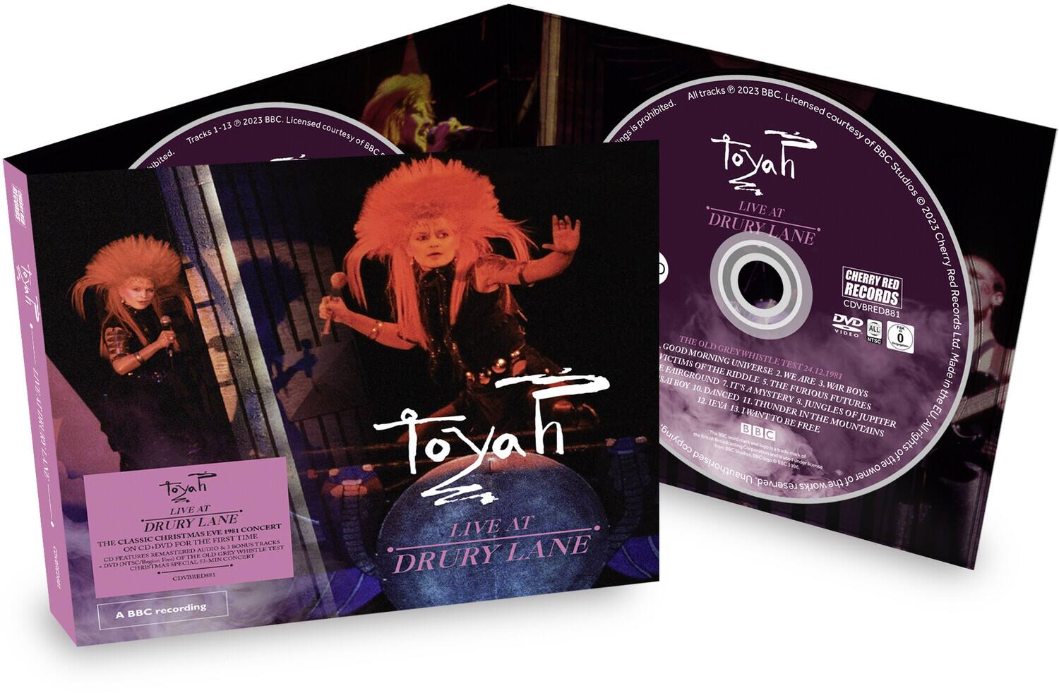 **Front Cover:**

- **Title:** ToyaH
- **Subtitle:** LIVE AT DRURY LANE
- **Additional Text:** THE CLASSIC CHRISTMAS EVE 1981 CONCERT
- **Description:** CD + DVD FOR THE FIRST TIME ON CD & DVD. REMASTERED AUDIO & DOMINATE THE RIDDLES OF THE UNIVERSE 2. WE ARE 3. WAR BOYS 4. IT'S A MYSTERY 5. FURIOUS FUTURES 6. JUNGLES OF JUPITER 7. I WANT TO BE FREE 8. MOUNTAINS
- **Label:** CHERRY RED RECORDS
- **Catalog Number:** CDVRE0881
- **Rating:** 0
- **Note:** A BBC recording

**Back Cover:**

- **Tracks:**
  1. GOOD MORNING WHISTLE TEST
  2. WE ARE THE RIDDLES OF THE UNIVERSE
  3. WE ARE 3. WAR BOYS
  4. IT'S A MYSTERY
  5. FURIOUS FUTURES
  6. JUNGLES OF JUPITER
  7