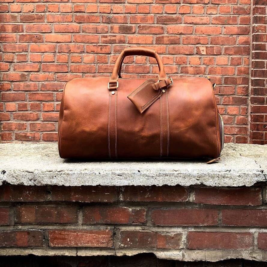 Left. Steel Horse Leather - The Dagny Weekender | Large Leather Duffle Bag - Dark Brown.