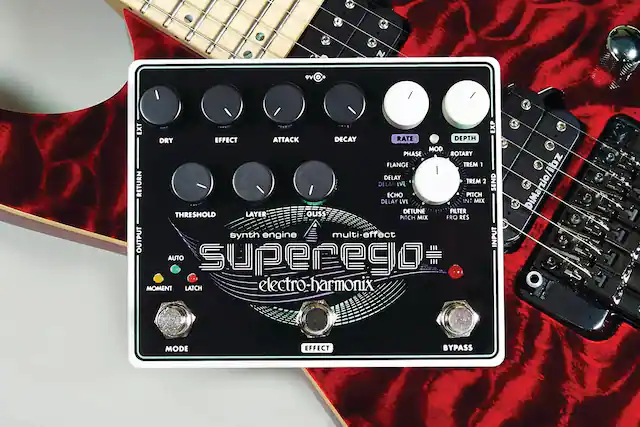 9V EXT EXP DRY EFFECT ATTACK DECAY RATE DEPTH MOD PHASE ROTARY FLANGE TREM 1 DELAY LV TREM 2 SEND RETURN DELAY ECHO PITCH DELAY LVL NT MIX DETUNE FILTER THRESHOLD LAYER GLISS PITCH MIX FRO RES synth engine multi-effect INPUT OUTPUT AUTO superedo MOMENT LATCH electro-harmonix DiMarzio/ibz E. MODE EFFECT BYPASS