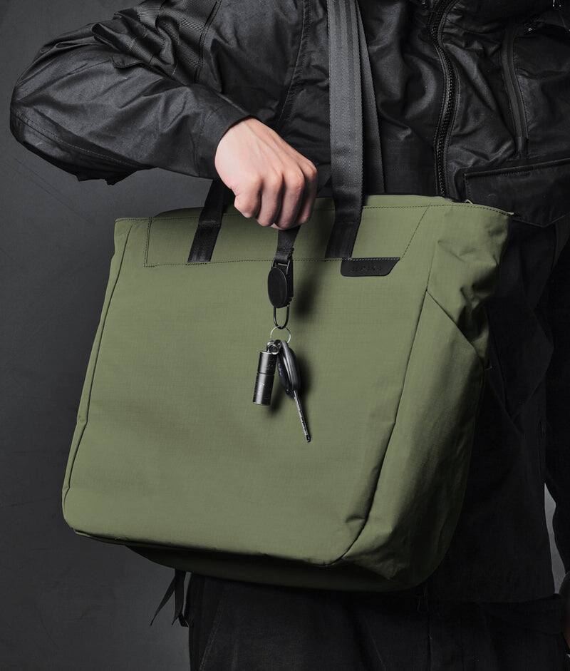 Alt View 1. ALPAKA - Metro Tote Laptop Tote Bag for Work, Work Tote Fits 16" MacBook Pro, Side Bottle Pocket, Weather-Resistant, Key Tether - Green Axoflux 210D.