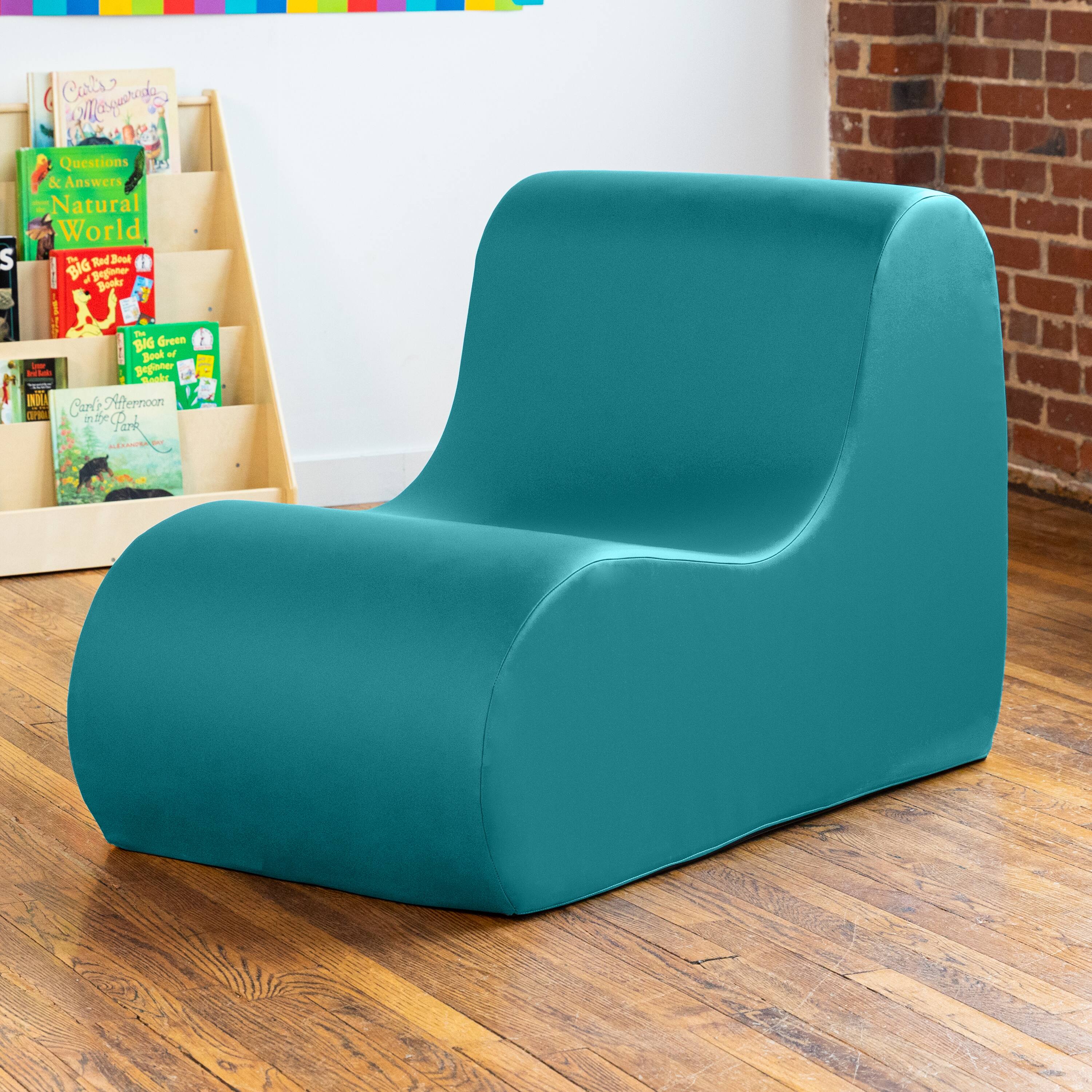 Sure, here is the corrected and grouped text from the image:

1. **Books on the Shelf:**
   - "Questions & Answers Natural World"
   - "Big Red Book of Dinosaurs"
   - "Big Green Book of Bugs"
   - "Carlo in the Park"
   - "Carlo in the Afternoon"

2. **Text on the Chair:**
   - "S Cars egarad"
   - "BAG Green Bouk"
   - "IO Crrle Nernoon OP"
   - "P Tod Book"
   - "yagate"