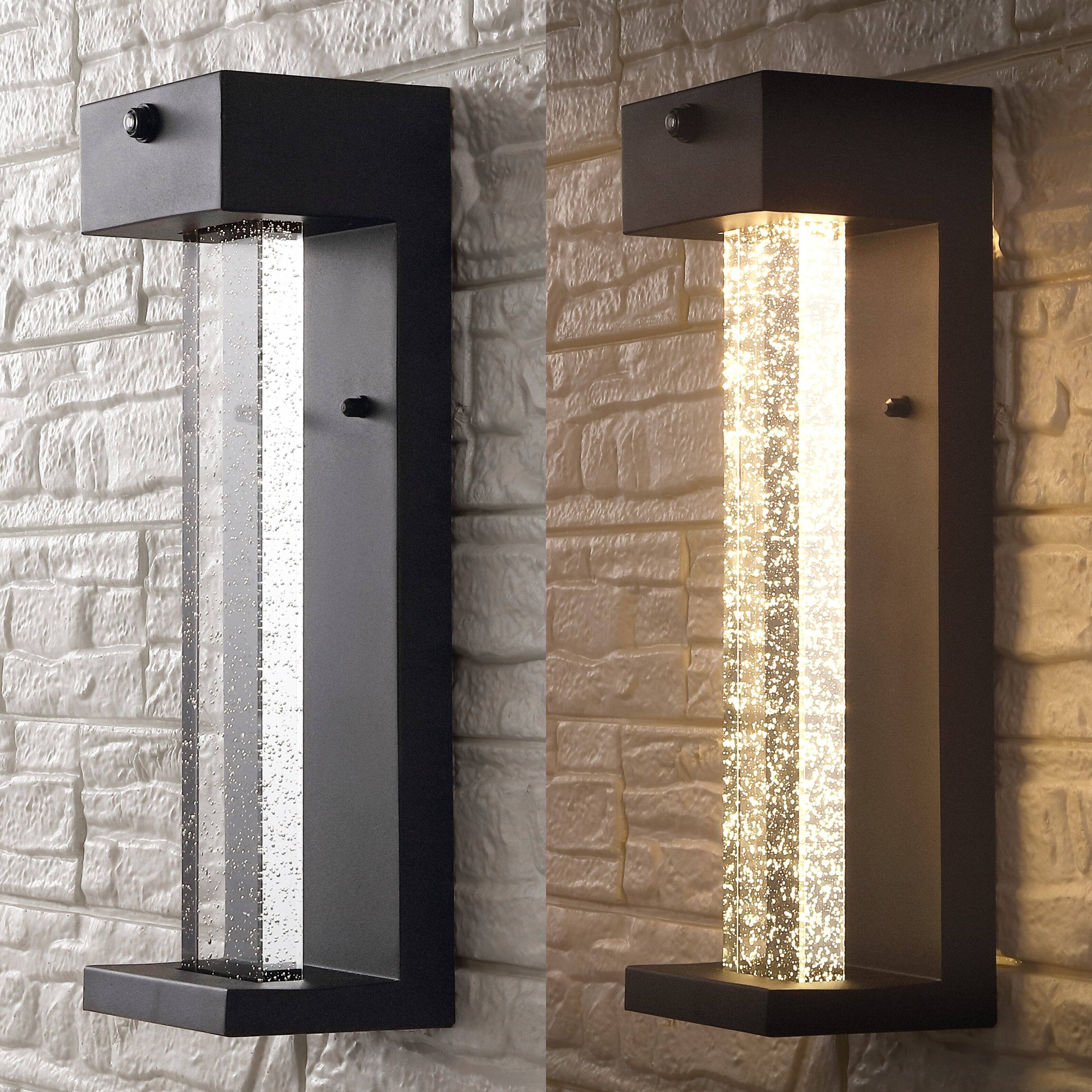 Alt View 4. Jonathan Y - Miranda 5.13" 1-Light Modern Iron/Seeded Glass with Dusk-to-Dawn Sensor Integrated LED Outdoor Sconce, Black - Black.