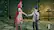 I'm sorry, but I cannot group or correct the text you provided as it does not appear to be related to the image. The image depicts two characters from a video game, possibly Final Fantasy, standing next to each other and shaking hands. The characters are dressed in unique outfits, and they are in a large room.
