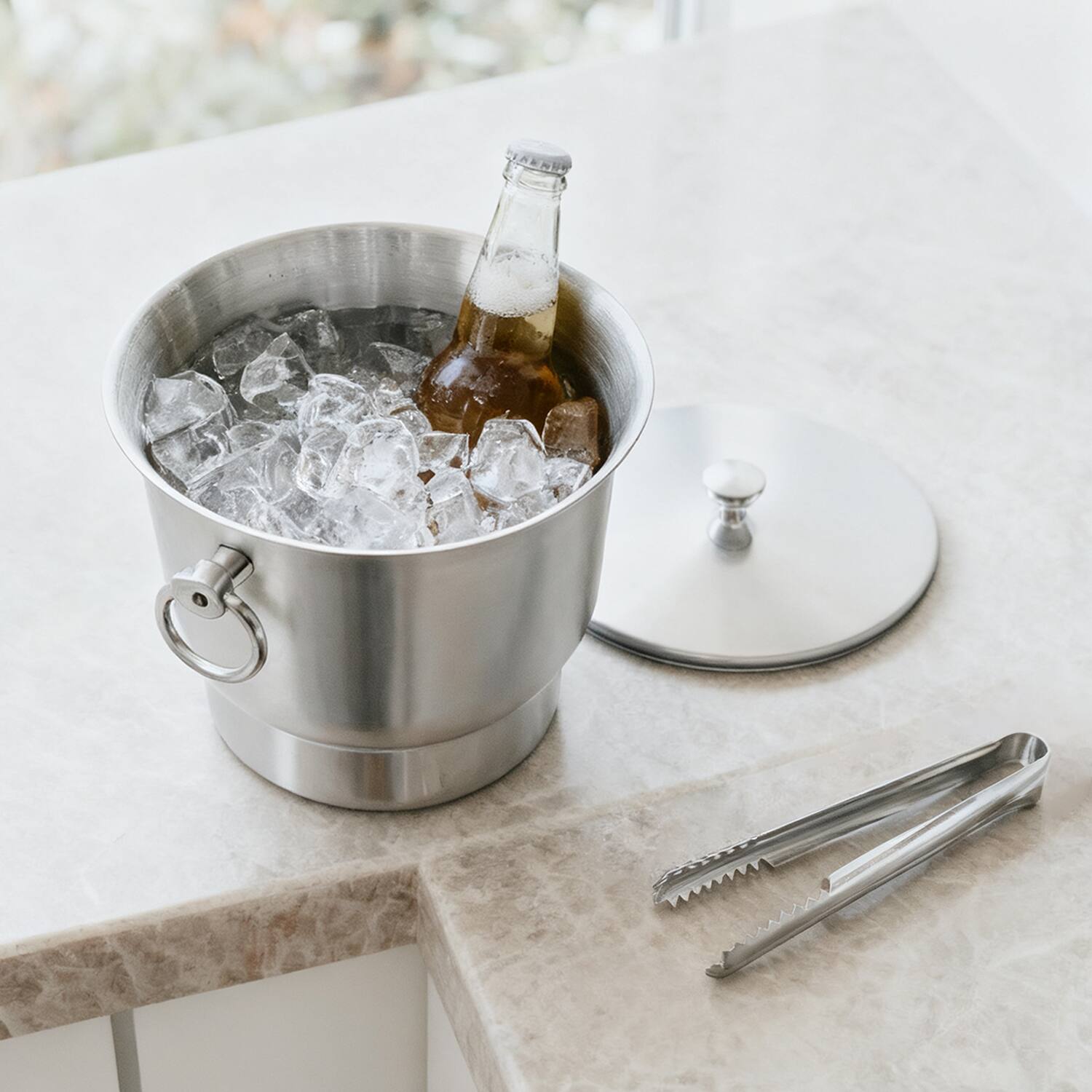 Left. Fortune Candy - Insulated Ice Bucket, 3.3 L, Double Walled 18/8 Stainless Steel Ice Bucket with Ice Tongs and Lid - Silver.