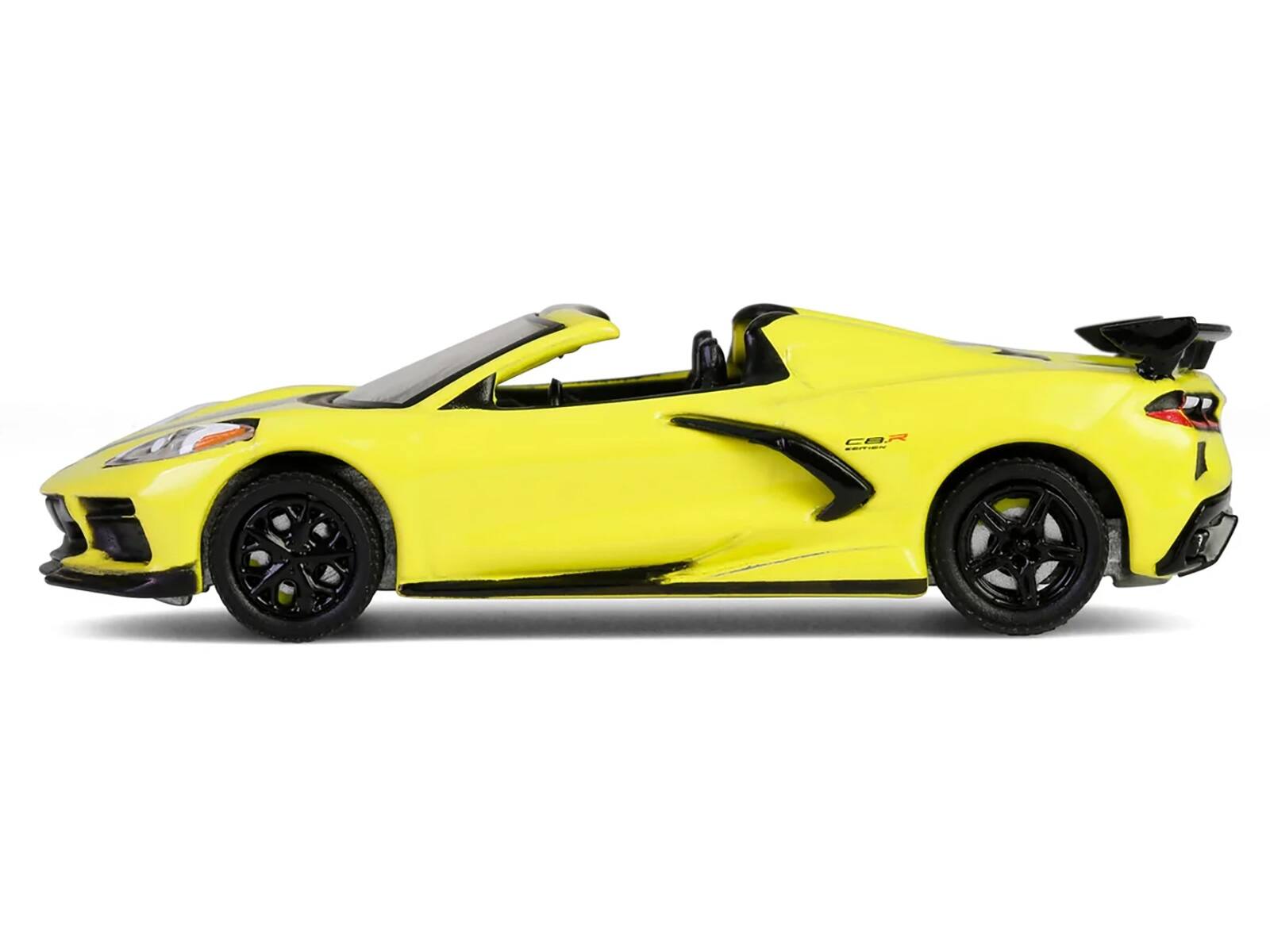 Angle. Greenlight - 2022 Chevrolet Corvette C8.R Convertible Yellow with Silver Stripes "Barrett-Jackson" Series 15 1/64 - Yellow with Silver.