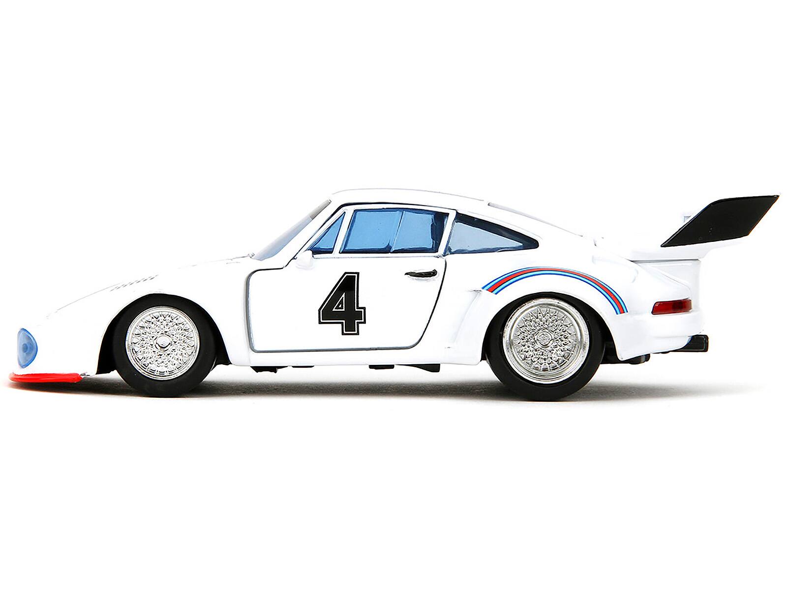 Left. Jada - Porsche 935 Turbo #4 "Jazz" White with Blue and Red Stripes "Transformers" "Hollywood Rides" Series 1/32 -  White With Blue And Red.
