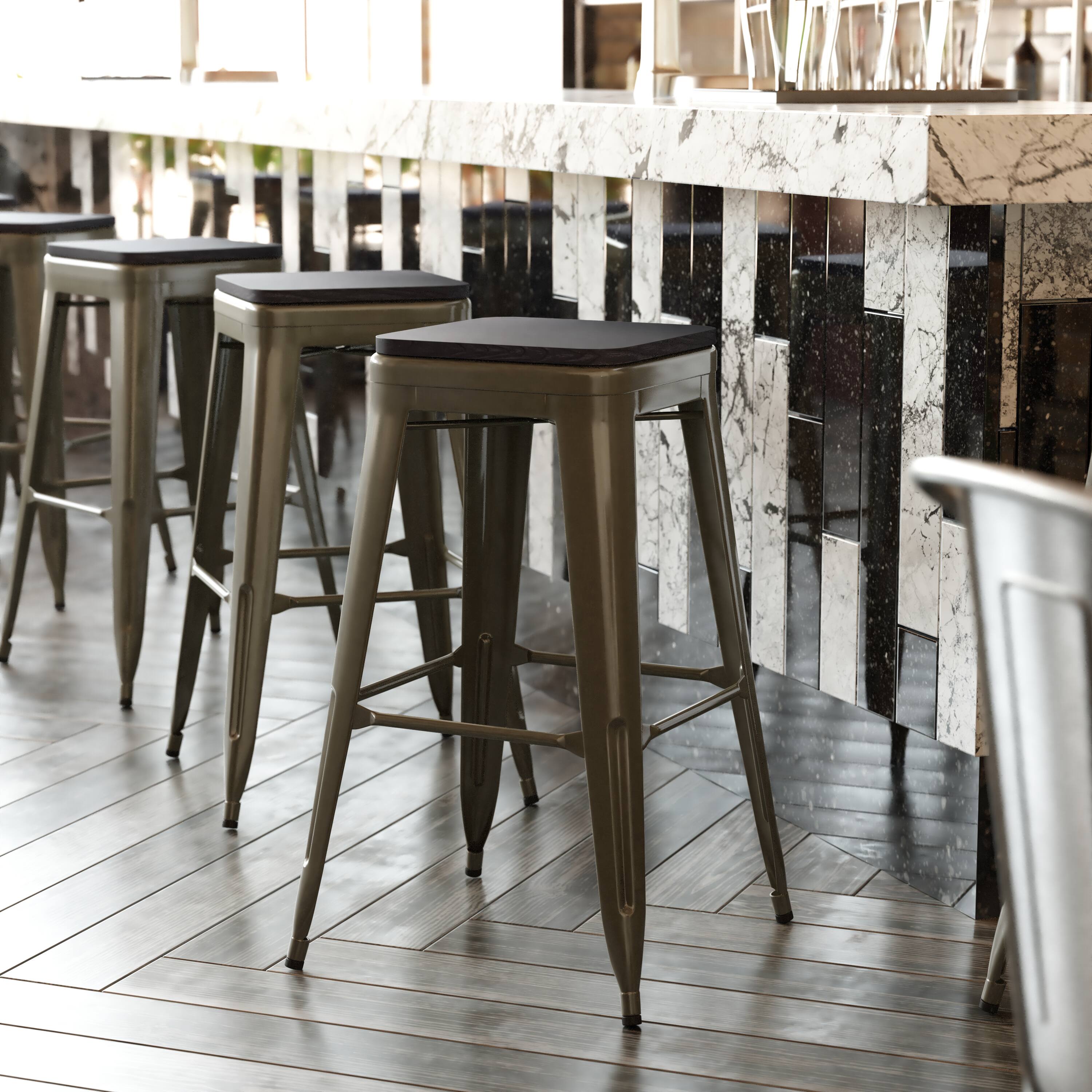 Alt View 3. Emma + Oliver - Cory Set of Four Backless Metal Stools with All-Weather Poly Resin Seats for Indoor Use Only - Black Resin Wood Seat/Gun Metal Frame.