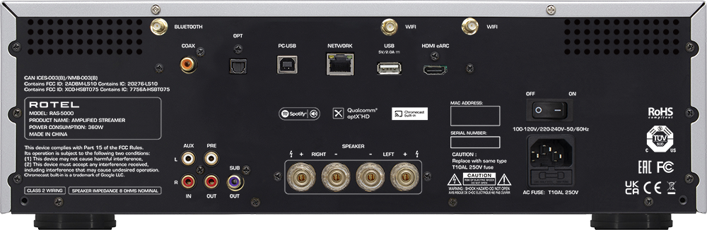 The text on the image is grouped and corrected as follows:

1. BLUETOOTH WIFI WIFI OPT COAX PC-USB NETWORK USB SV/2.0A HOMI eARC CAN ICES-003(BI/NMB-003(B) Contains FCC ID 2ADBM-LS10 Contains IC: 202764S10 Contains FCC ID: XCO-HSBT075 Contains IC: 7756A-HS8T075 ROTEL MODEL: RAS-5000 PRODUCT NAME: AMPLIFIED STREAMER POWER CONSUMPTION: 25W MADE IN CHINA This device complies with Part 15 of the FCC Rules. AUX its operation is subject to the following Eo conditions: (1) This device may not cause harmful interference, (2) This device muSE accept any interference received, including interference that may cause undesired operation. Chromecast Suitin is a nb of Google LLC R CLASS 2 WIRING SPEAKER IMPEDANCE . OHMS NOMINAL IN PRE OUT SUB OUT Spotity RIGHT Qualcomm X ptH HD SPEAKER LEFT Oromecas S  OFF ON MAC ADORESS: 100-120V/220-240V-50/6OHz SERIAL NUMBER CAUTION : Replace with same type T10AL 250V fuse CAUTION WANNG SHOOK NAZARO-OO NOT OPEN MRO 3 CHOC LCTRO ~ ARAIC AC FUSE: T10AL 250V RoHS TUV BUC  US EAC FC U