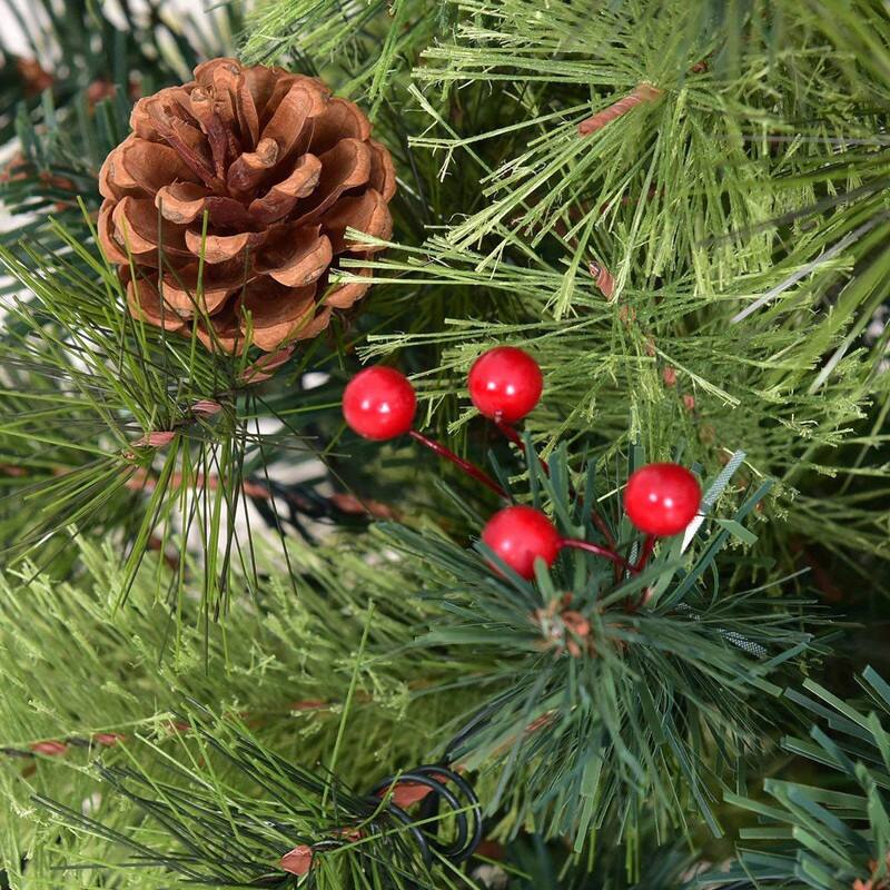 Left. WELLFOR - 4 ft Pre‑Lit Pre‑Decorated Artificial Christmas Tree with Warm‑White LEDs, Red Berries & Pine Cones - Green.