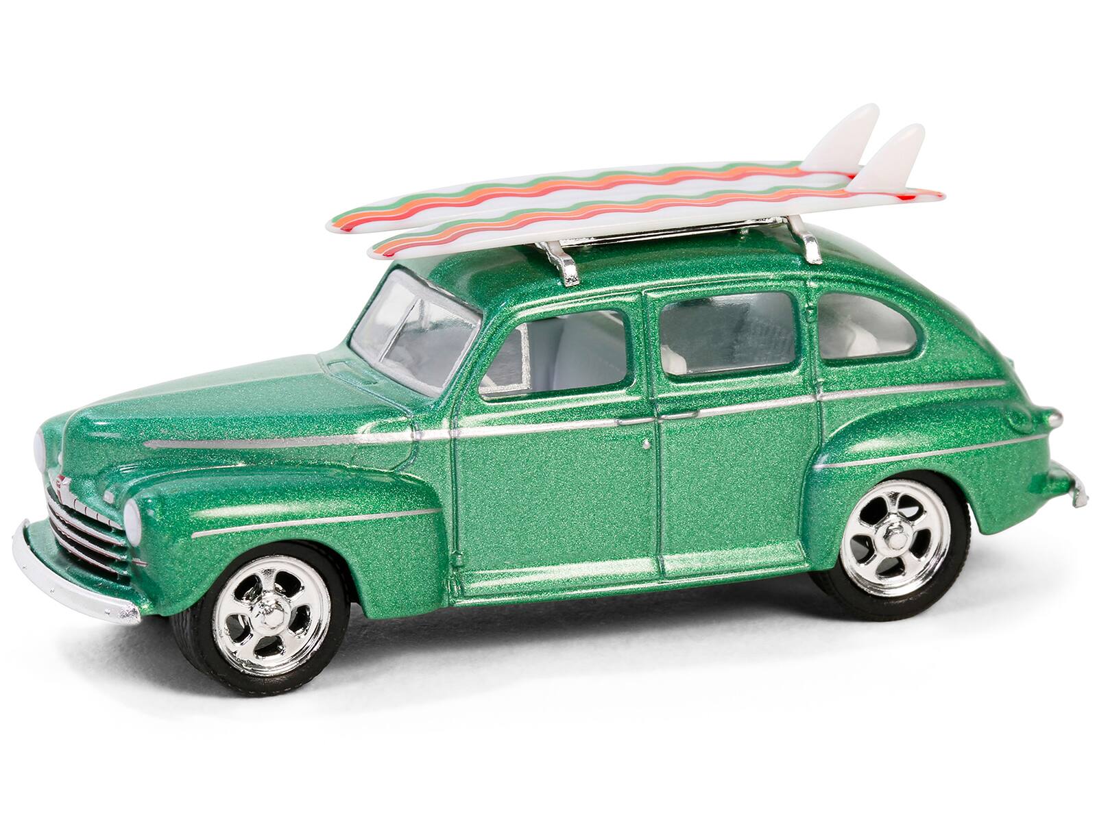 Angle. Greenlight - 1946 Ford Fordor Super Deluxe Green Metallic with White Interior & Roof Rack with Surfboards "The Hobby Shop" 1/64 - Green Metallic With White.