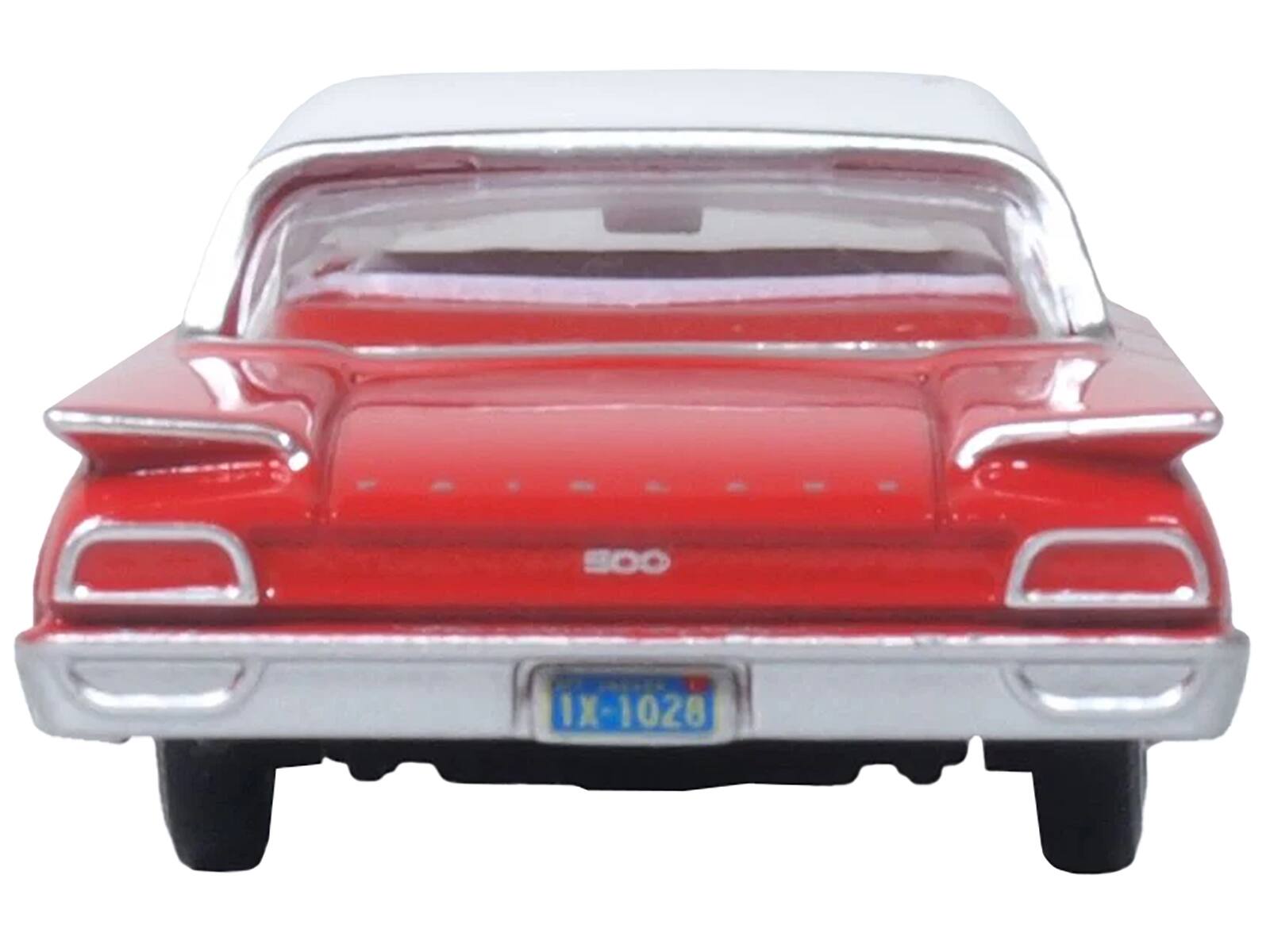 The text on the image is:

- "SOO" (on the trunk)
- "1X-1028" (on the license plate)