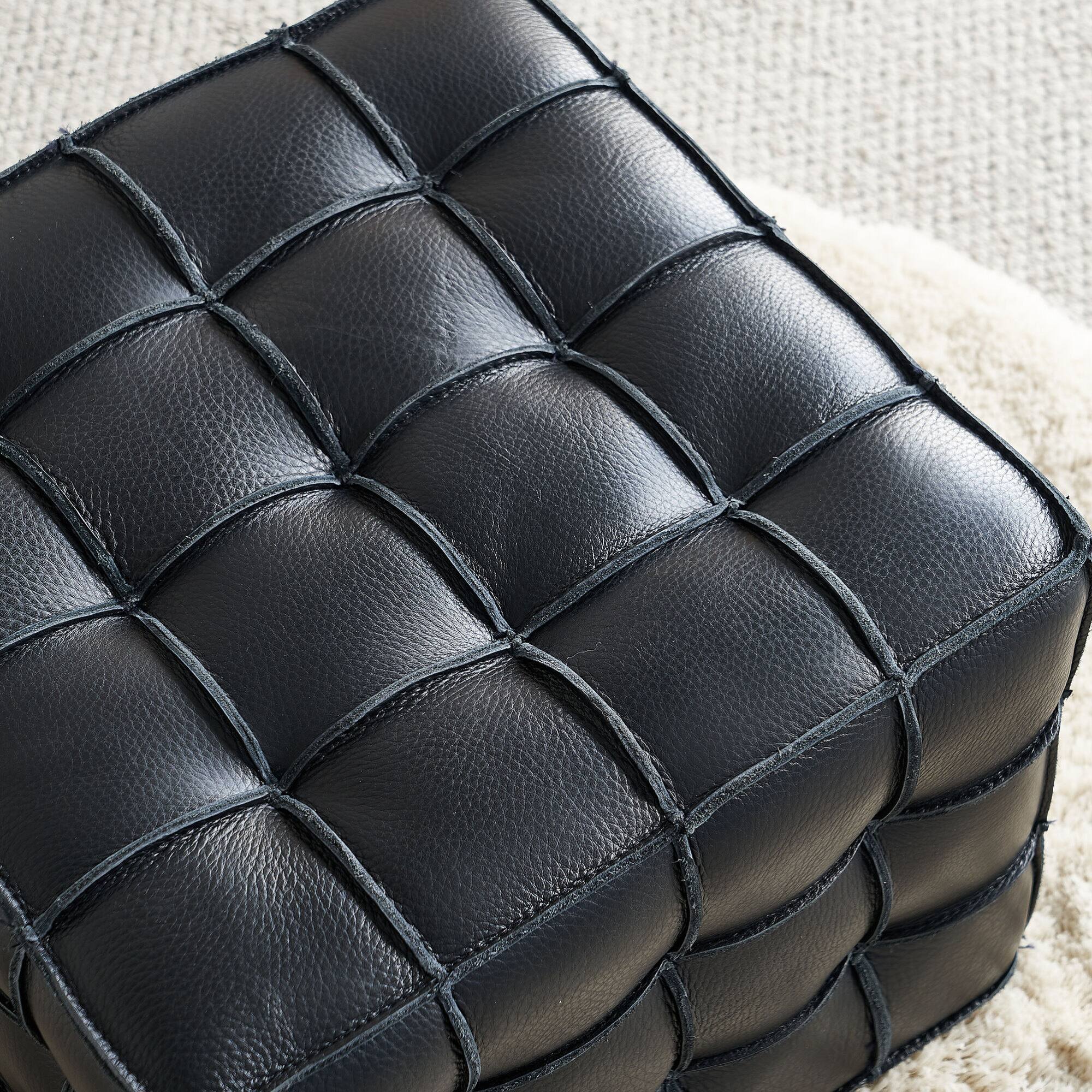 Angle. GOODSILO - Genuine Leather Tufted Ottoman with Solid Wood Frame for Living Room and Bedroom Footrest and Seating - Black.