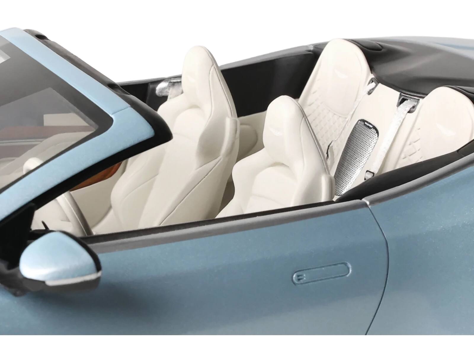 Angle. GT Spirit - 2023 Aston Martin DB12 Volante Caribbean Blue Pearl with White Interior 1/18 Model Car by GT Spirit - Blue Pearl with White.