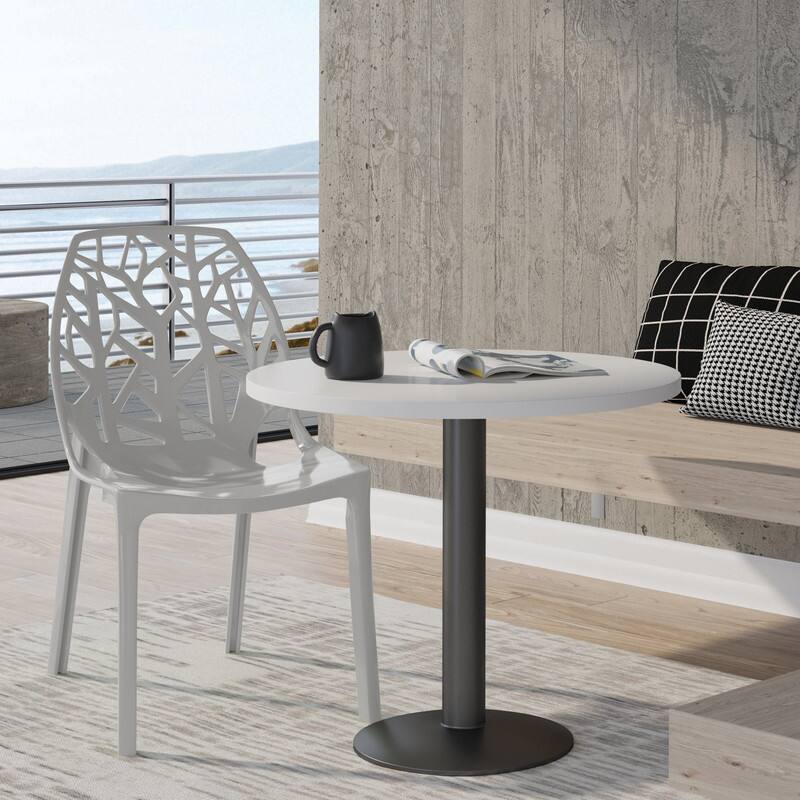 Angle. LeisureMod - Cornelia Modern Stackable Accent Dining Chair with Cut Out Backrest Design for Dining Rooms or Patios - Solid Grey.