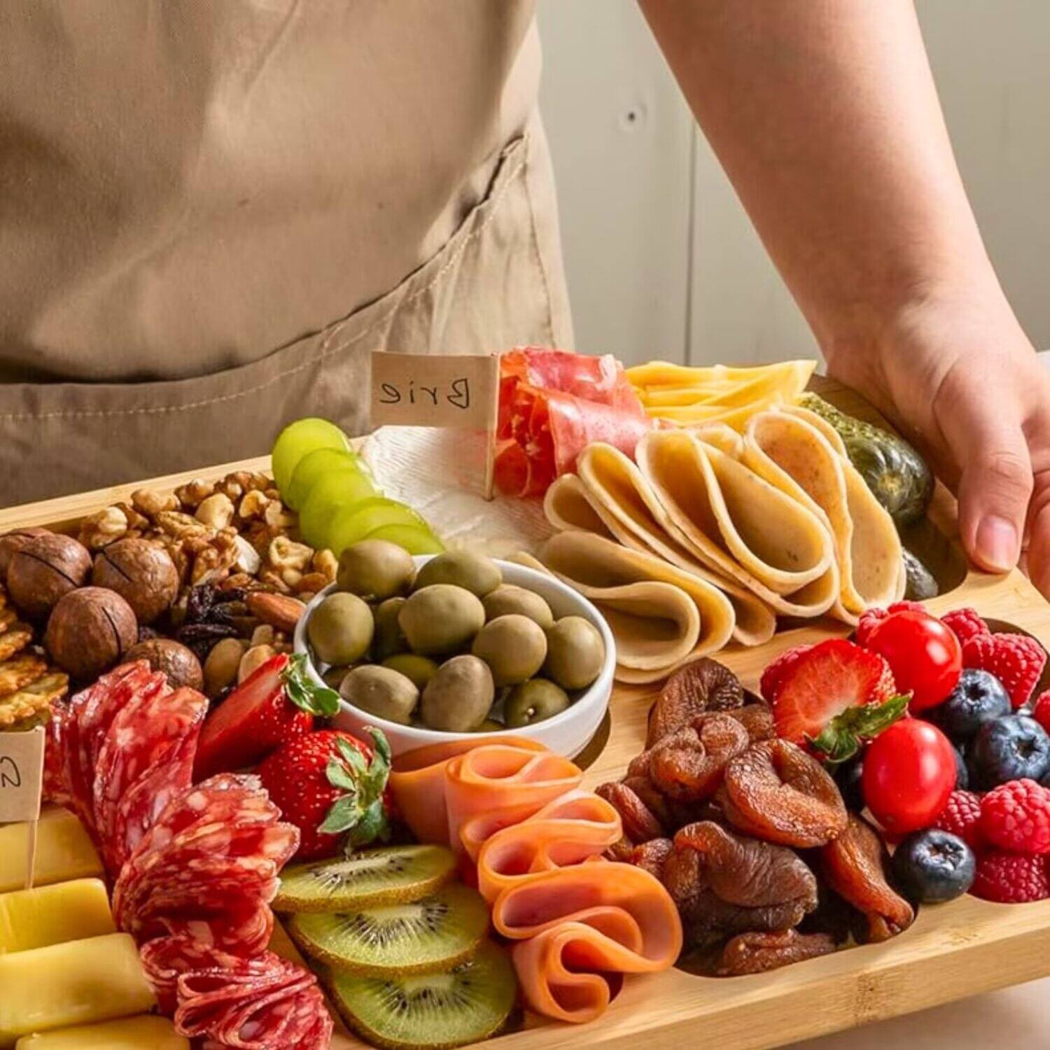 Angle. Tooloton - Bamboo Charcuterie Board with Lid, 8 Compartments Portable Cheese Cutting Boards, Black Handles - Natural.