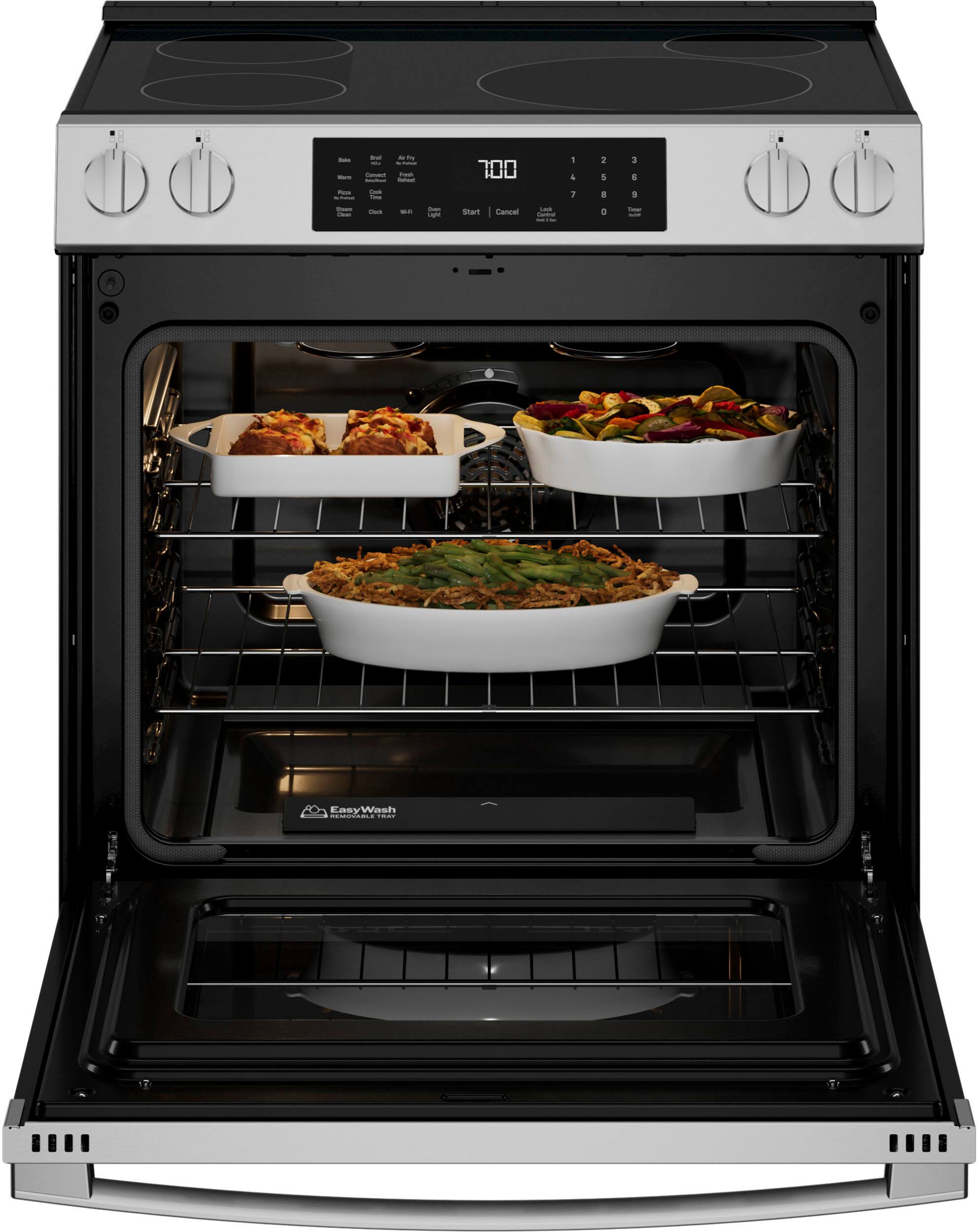 The image shows a stove with three dishes cooking inside. The dishes are placed on a rack, and they are filled with food. The stove is an oven, and it is likely that the food is being cooked at a high temperature. The dishes are placed in a way that allows for even heat distribution and efficient cooking. The oven is designed to handle multiple dishes at once, making it a convenient and efficient appliance for preparing meals.