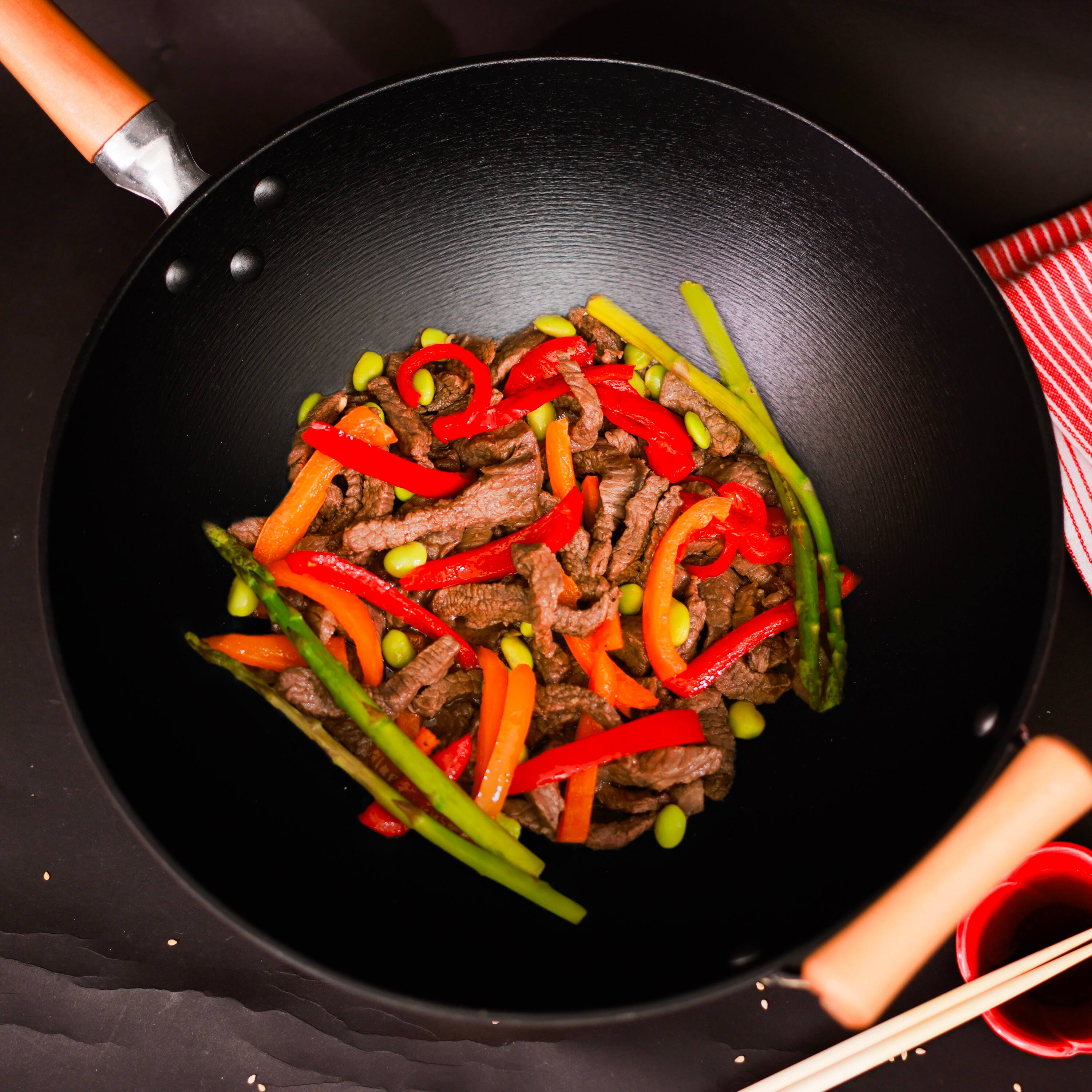 Alt View 6. Escali - Joyce Chen Professional Series 14-Inch Preseasoned Cast Iron Flat Bottom Wok with Maple Handle - Black.