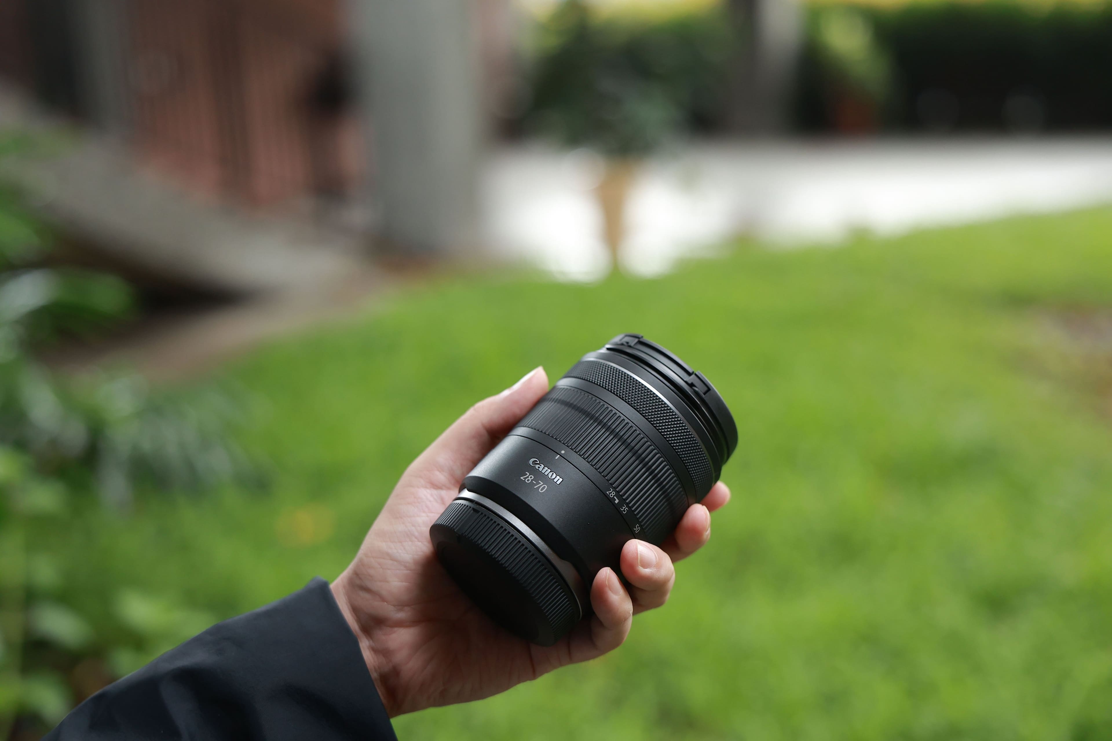 The text on the image reads "28-70 Canon 28-70 28-35 o." This is a description of a camera lens, which is a 28-70mm lens made by Canon. The lens has a focal length of 28-70mm and a maximum aperture of 35mm.