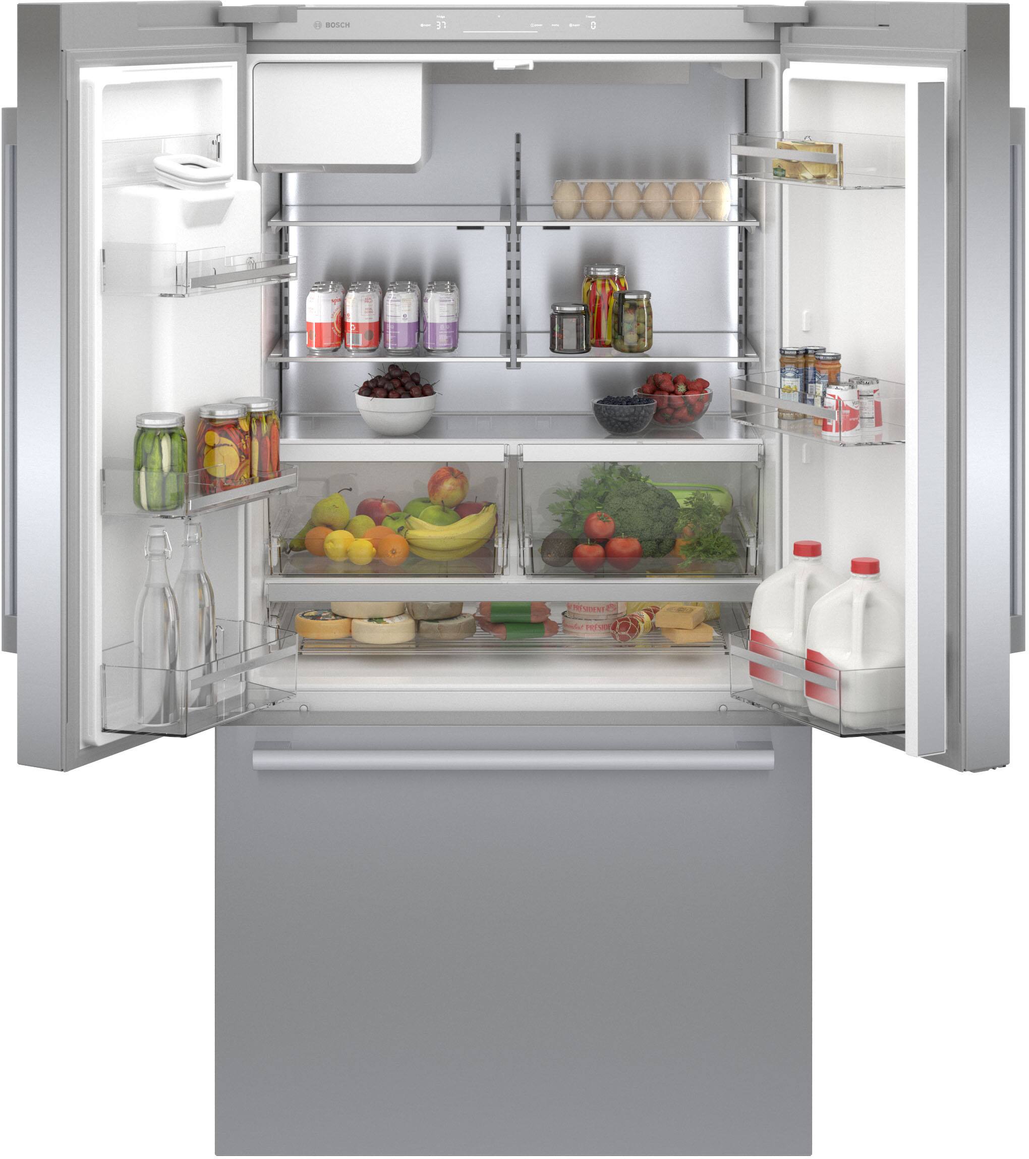 The image shows a refrigerator with its door open, revealing a variety of food items inside. There are several bottles, including milk, and a bowl of fruit. The refrigerator is well-stocked with a variety of food items, making it an appealing sight for anyone who enjoys a diverse selection of food.