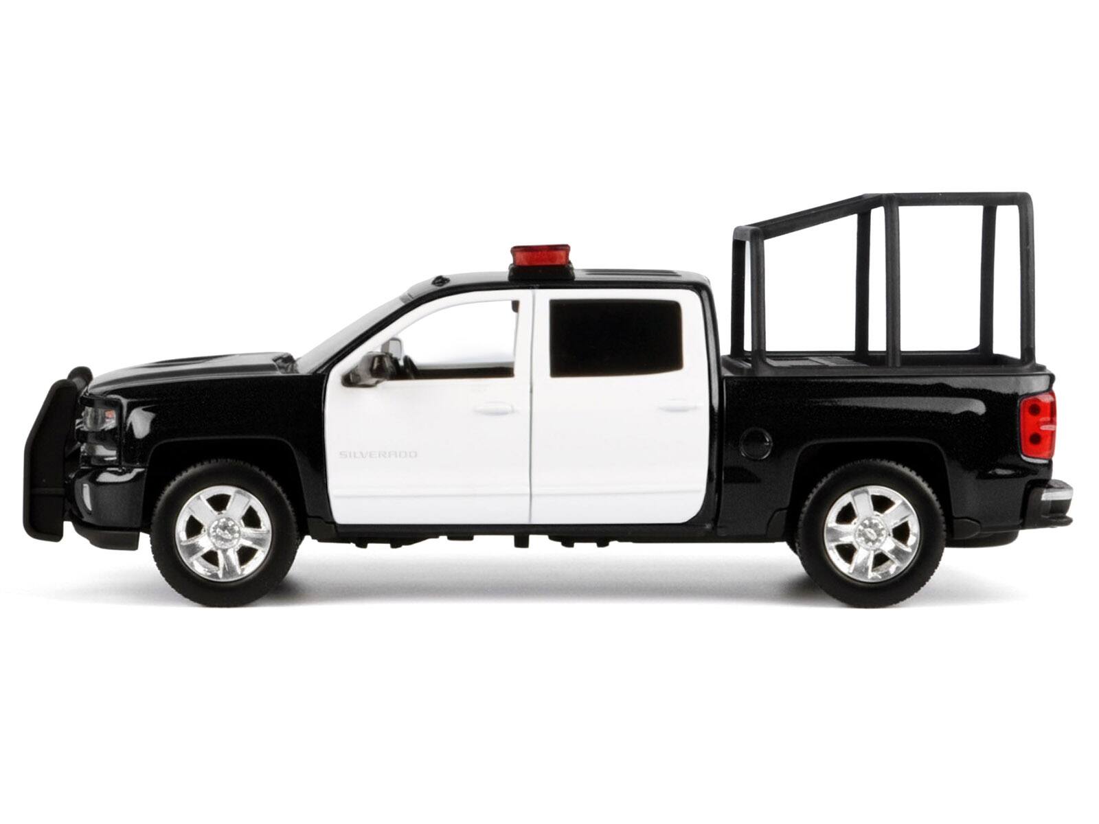 Alt View 2. Motormax - 2017 Chevrolet Silverado 1500 LT Z71 Crew Cab Truck w/Bed Cage Black & White w/Lights & Sounds 1/27 Model Car Motormax.