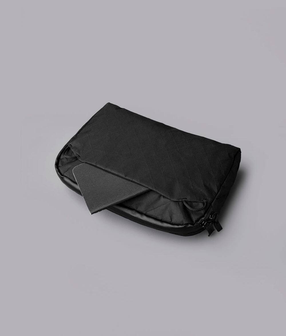 Back. ALPAKA - Flight Sling 2L Travel Sling Bag, Lightweight Packable Crossbody Pouch, Fits iPad Mini/Switch, Passport Pocket - Black Ultradyne 100D.