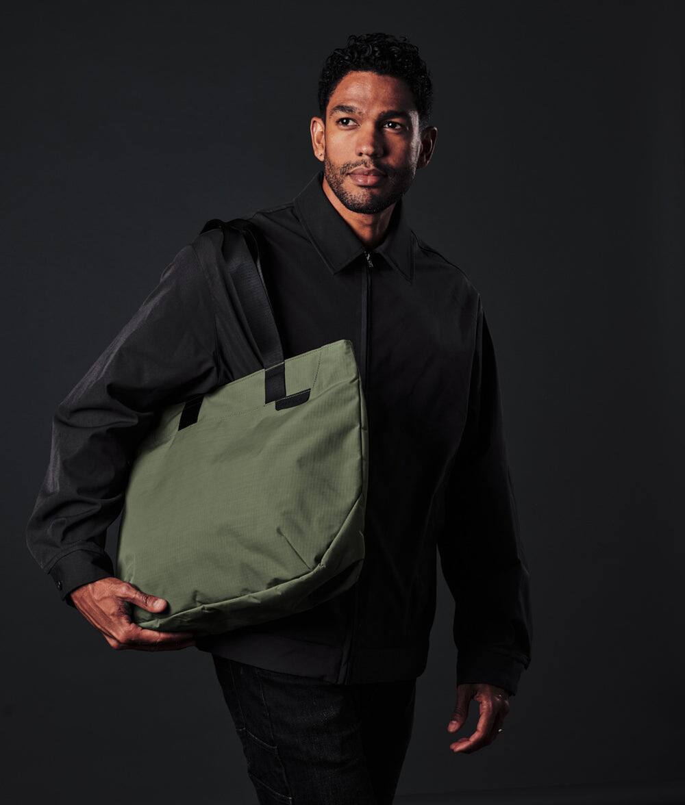 Left. ALPAKA - Elements Tote Bag 14.5L Weatherproof Foldable Travel Tote with Magnetic Closure - Green/G Axoflux 210D.