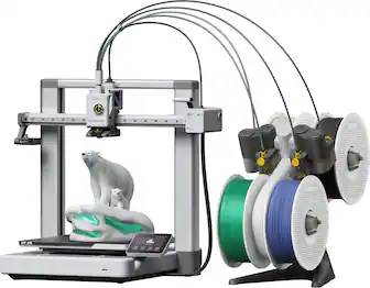 The image features a 3D printer with a white polar bear figurine on top of it. The printer is surrounded by multiple spools of green and white filament, which are used to create the 3D printed objects. The printer is equipped with a touch screen, allowing for easy operation and control. The scene showcases the versatility and capabilities of the 3D printer, as it can create intricate and detailed objects like the polar bear figurine.