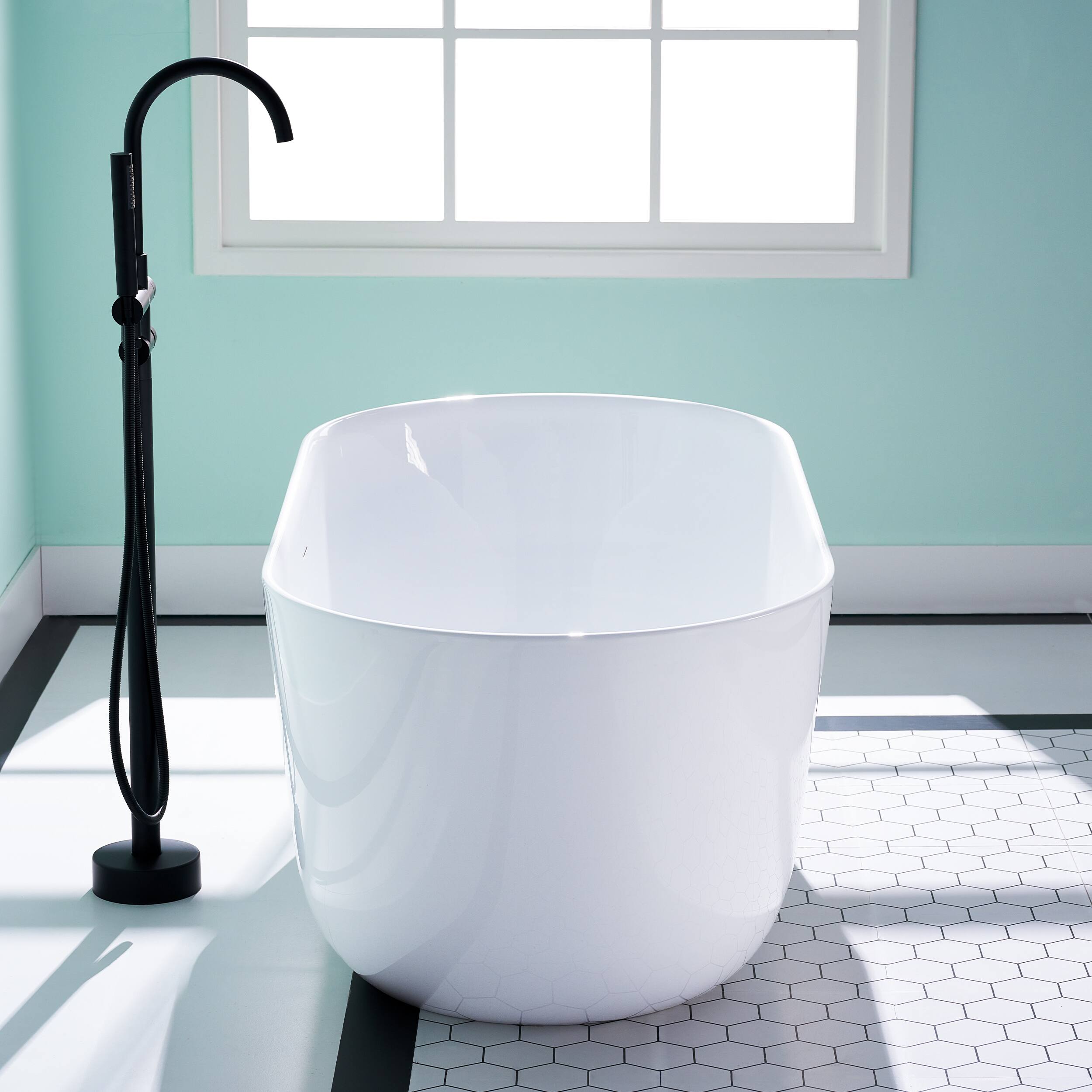 Left. WELLFOR - Seren 59 in. x 28 in. Acrylic Oval Freestanding Soaking Bathtub with Center Pop-Up Drain and Overflow - White.