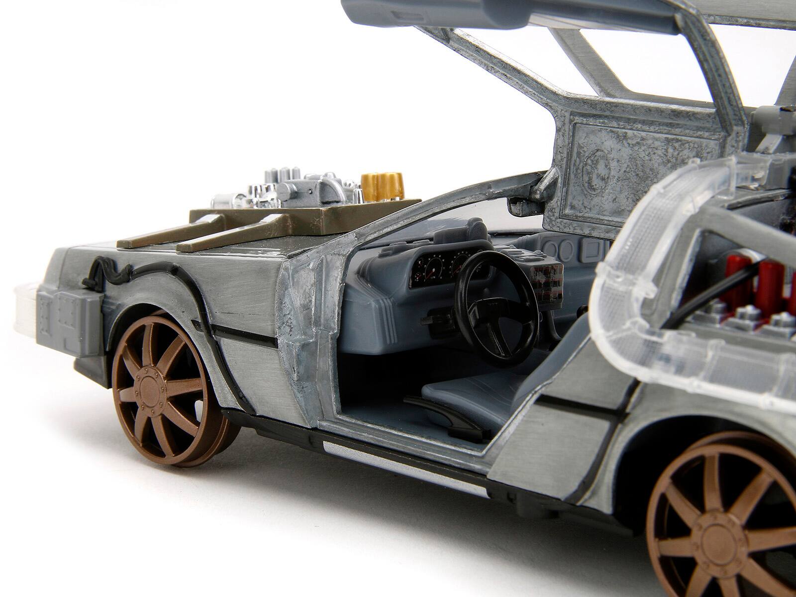 Left. Jada - DeLorean Brushed Metal Time Machine Train Wheel Version with Lights Back to the Future Part III Movie 1/24 Rides - Grey.