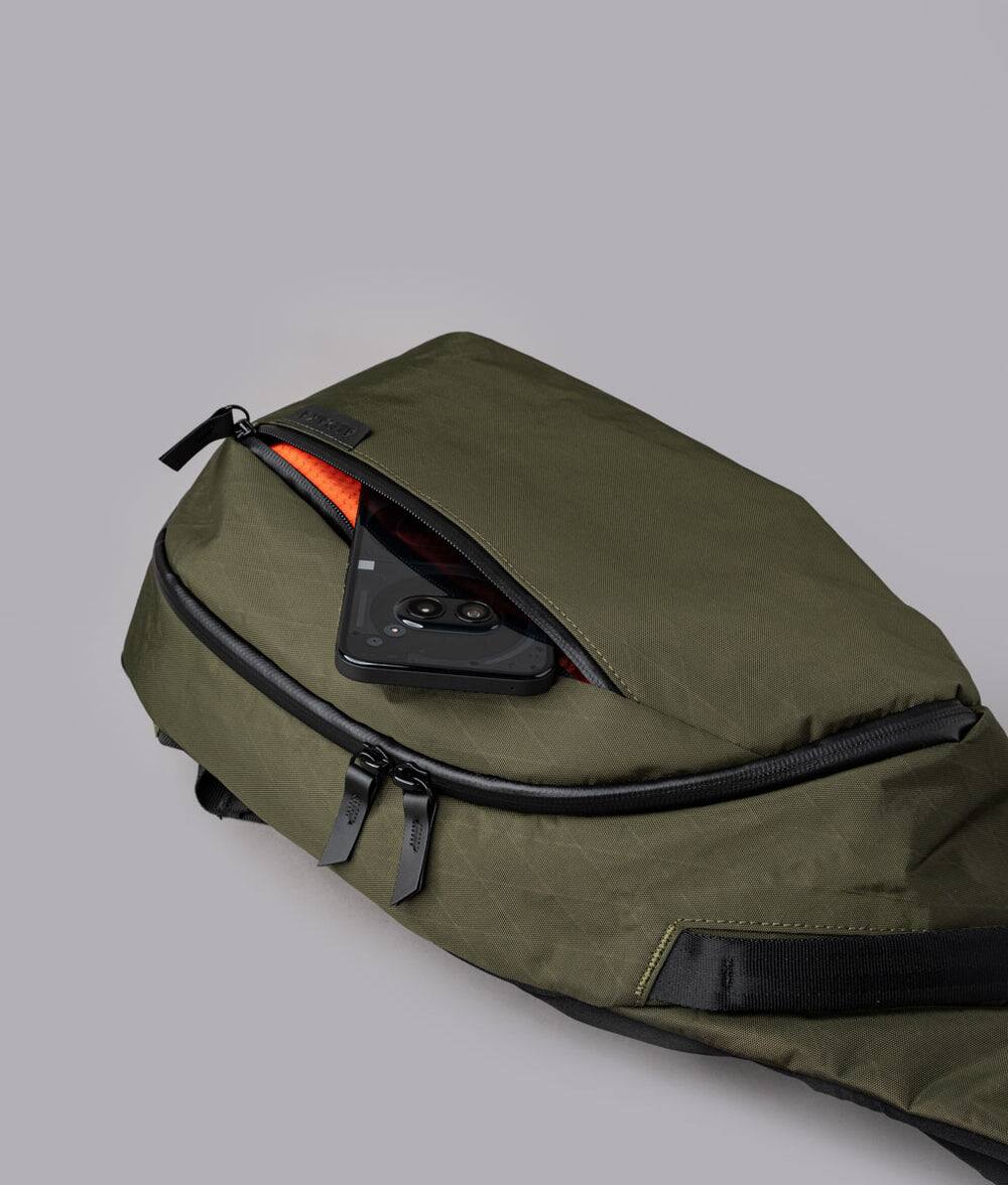 Alt View 5. ALPAKA - Crossbody Sling Bag 7.5L (Left Shoulder) for Men, Fits 11" Tablet, Phone Sleeve, Bottle Pocket, Luggage Pass-Through - Olive Green X-Pac X42.