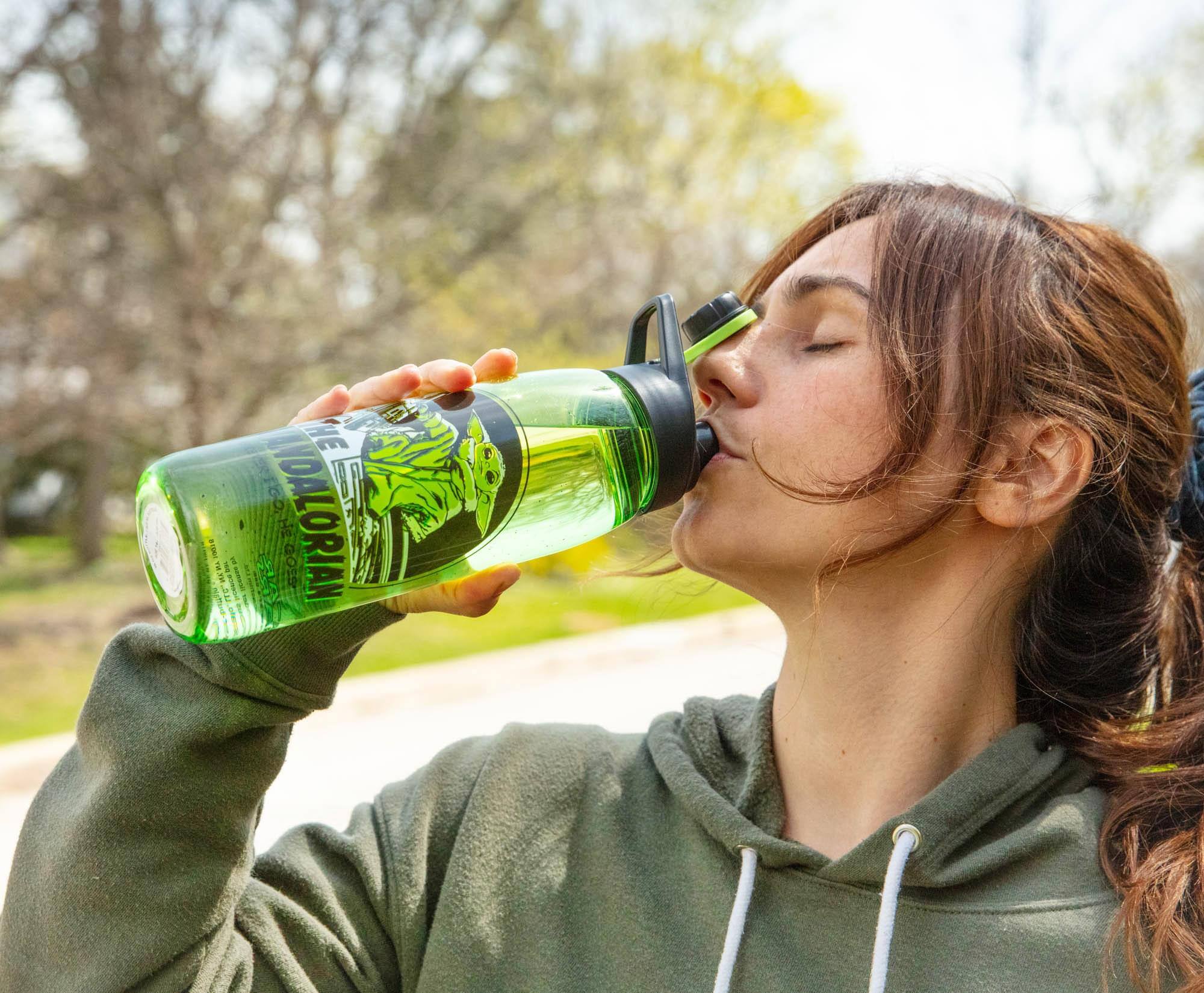 The text on the image reads:

"100% ORGANIC
H2O
550ml
TLC.NK
S.U"