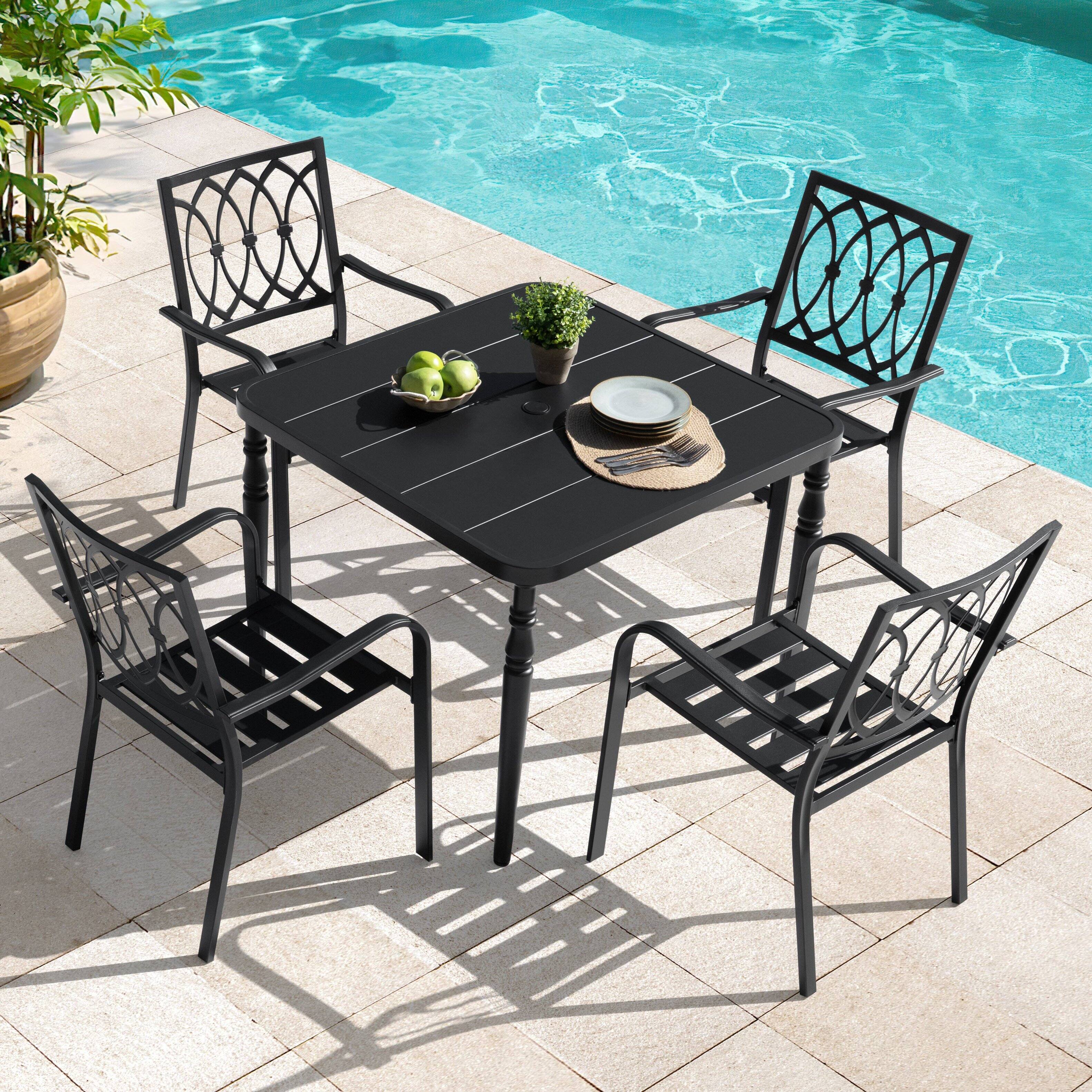 Left. Nuu Garden - 5-Piece Metal Patio Dining Set with Umbrella Hole and 4 Stackable Chairs - Black.