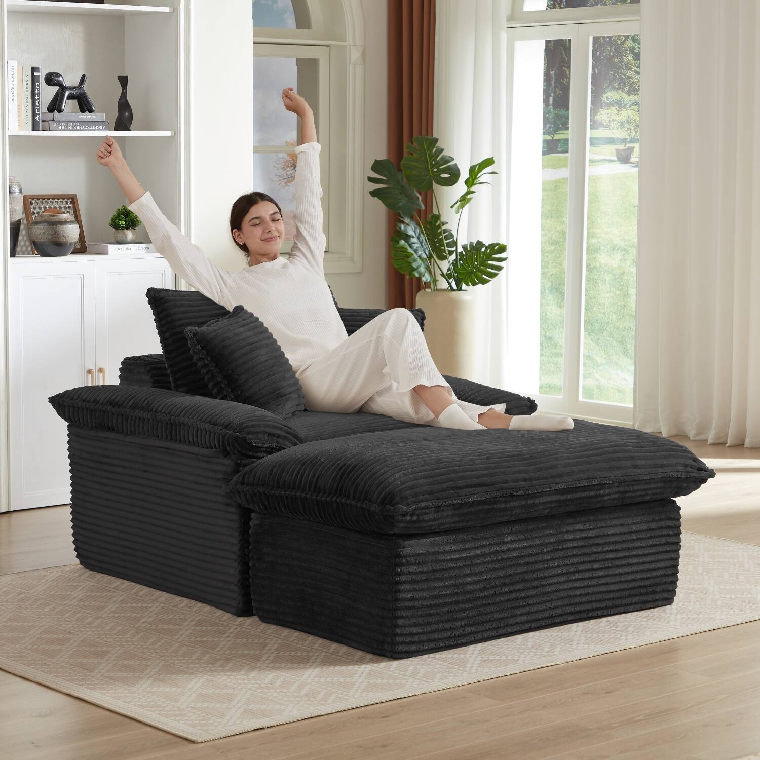 Left. Z-Edge - 52" modern cushioned compression sofa with unique footrest design, lounge chair for any room or office -Black - black.