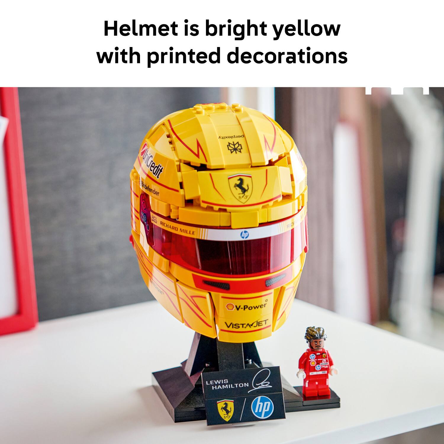 Helmet is bright yellow with printed decorations. CitiCredit, Bridgestone, Richard Mille, V-Power, VISTAJET. Lewis Hamilton.