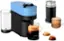 The image features a Nespresso machine, which is a coffee maker. The machine is blue and black and is accompanied by various coffee-making accessories such as cups, a milk frother, and a coffee grinder. There are also coffee beans and a coffee mug in the scene. The Nespresso machine is designed to make espresso, and it is a popular choice for coffee enthusiasts due to its ease of use and high-quality coffee.