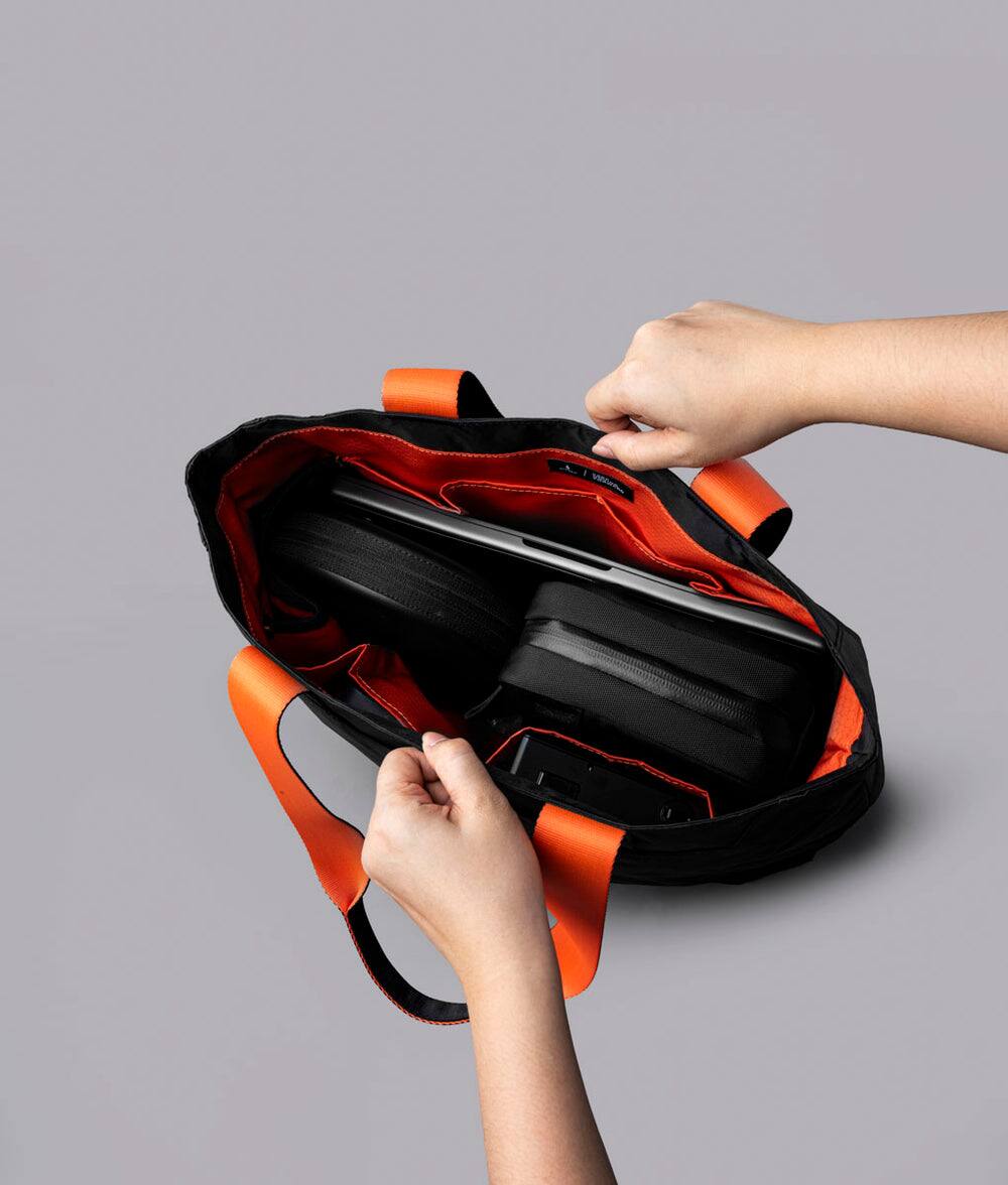 Alt View 4. ALPAKA - Elements Tote Bag 14.5L Weatherproof Foldable Travel Tote with Magnetic Closure - Black Axoflux 210D.