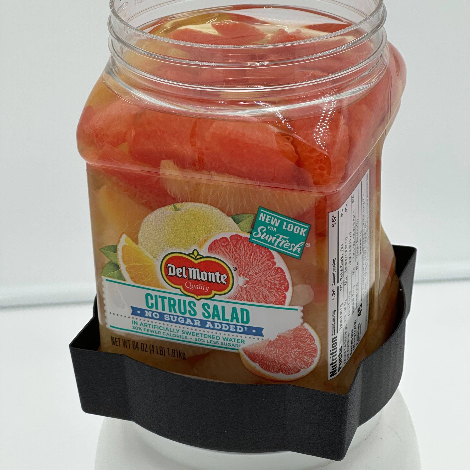 Sure, here is the corrected and grouped text from the image:

---

**Del Monte Quality**

**SunFresh**

**CITRUS SALAD**

- NO SUGAR ADDED
- 20% ARTIFICIALLY SWEETENED
- 50% LESS SUGAR
- 50% WATER

**NET WT 64 OZ (4 LB) 1.81kg**

**NEW LOOK**

**Nutrition Facts**

---

This text is organized to reflect the information on the label of the product.