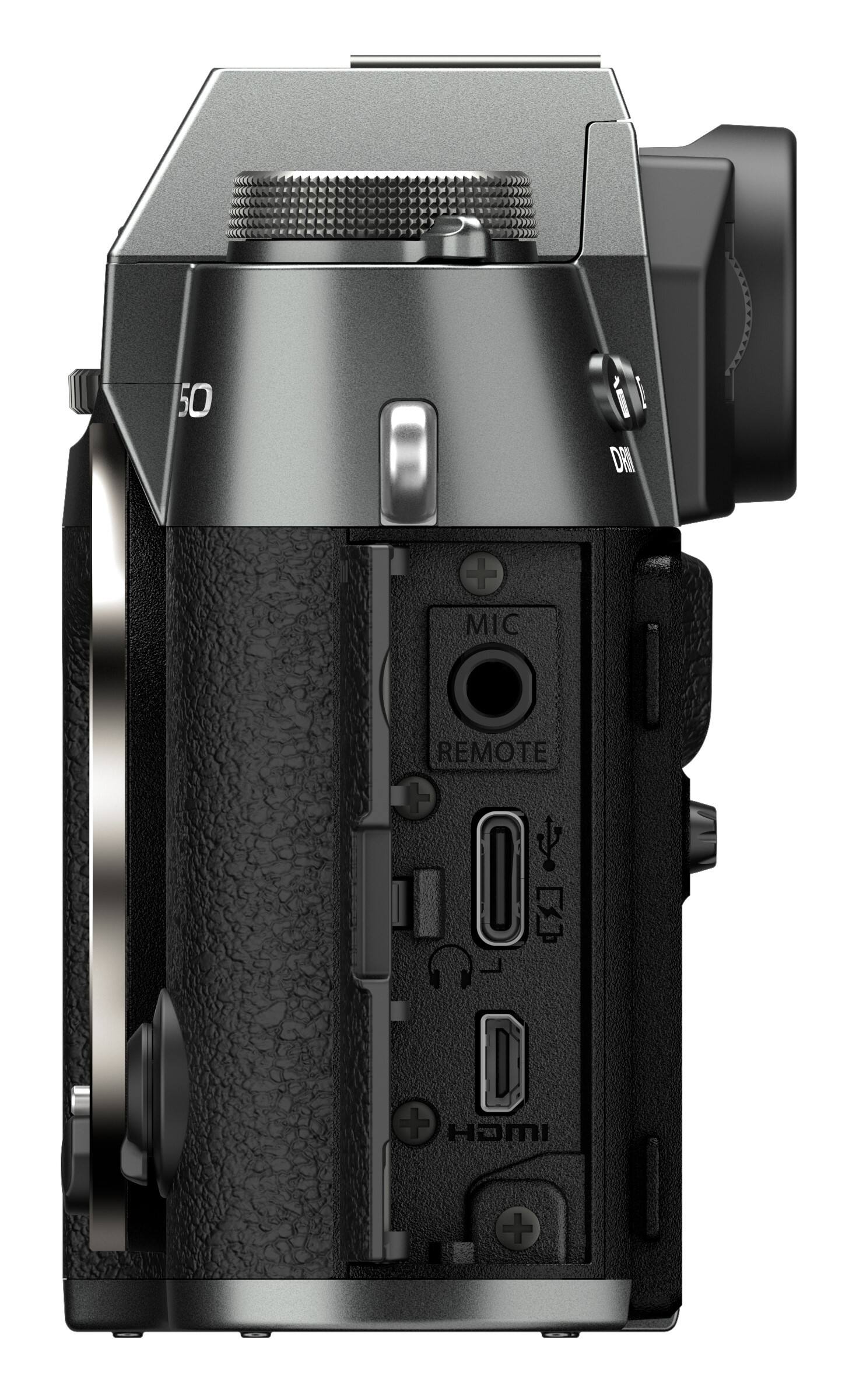 The image features a close-up of a digital camera, specifically a Canon camera. The camera is black and silver in color, and it has a remote control attached to it. The remote control is located on the right side of the camera, and it is connected to the camera via a cord. The camera is positioned against a white background, which highlights its features and design.