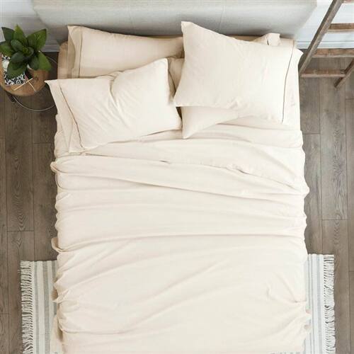 Left. SlickBlue - Wrinkle-Resistant Microfiber/Polyester Sheet Set for Easy Care Bedding - Ivory.