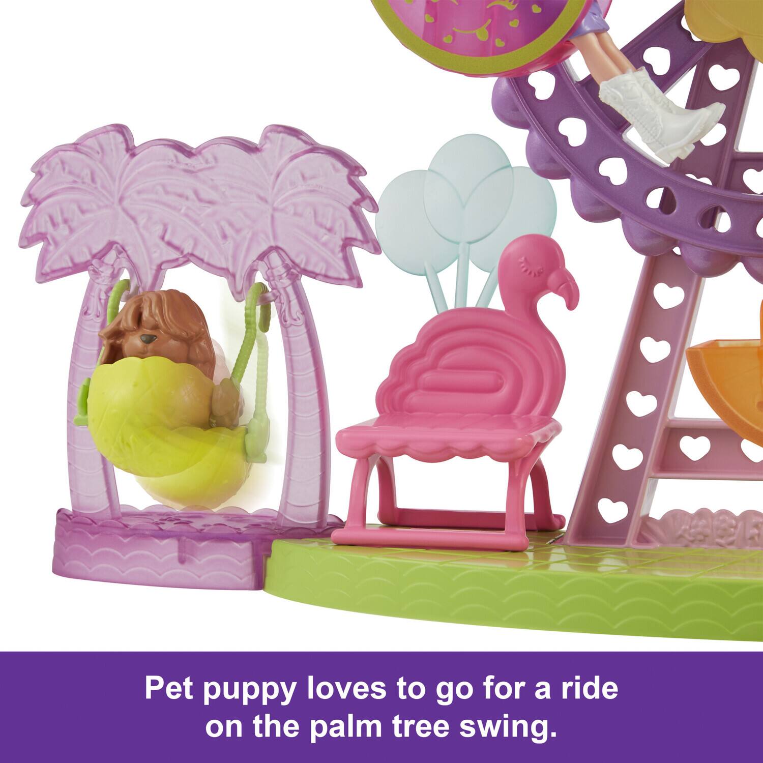 Pet puppy loves to go for a ride on the palm tree swing.