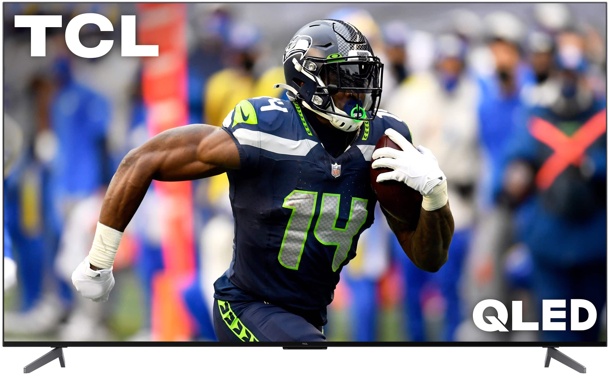 TCL is displaying a football player running with a football in his hand. The player is wearing a blue and green jersey. The image is advertising a TCL QLED television.