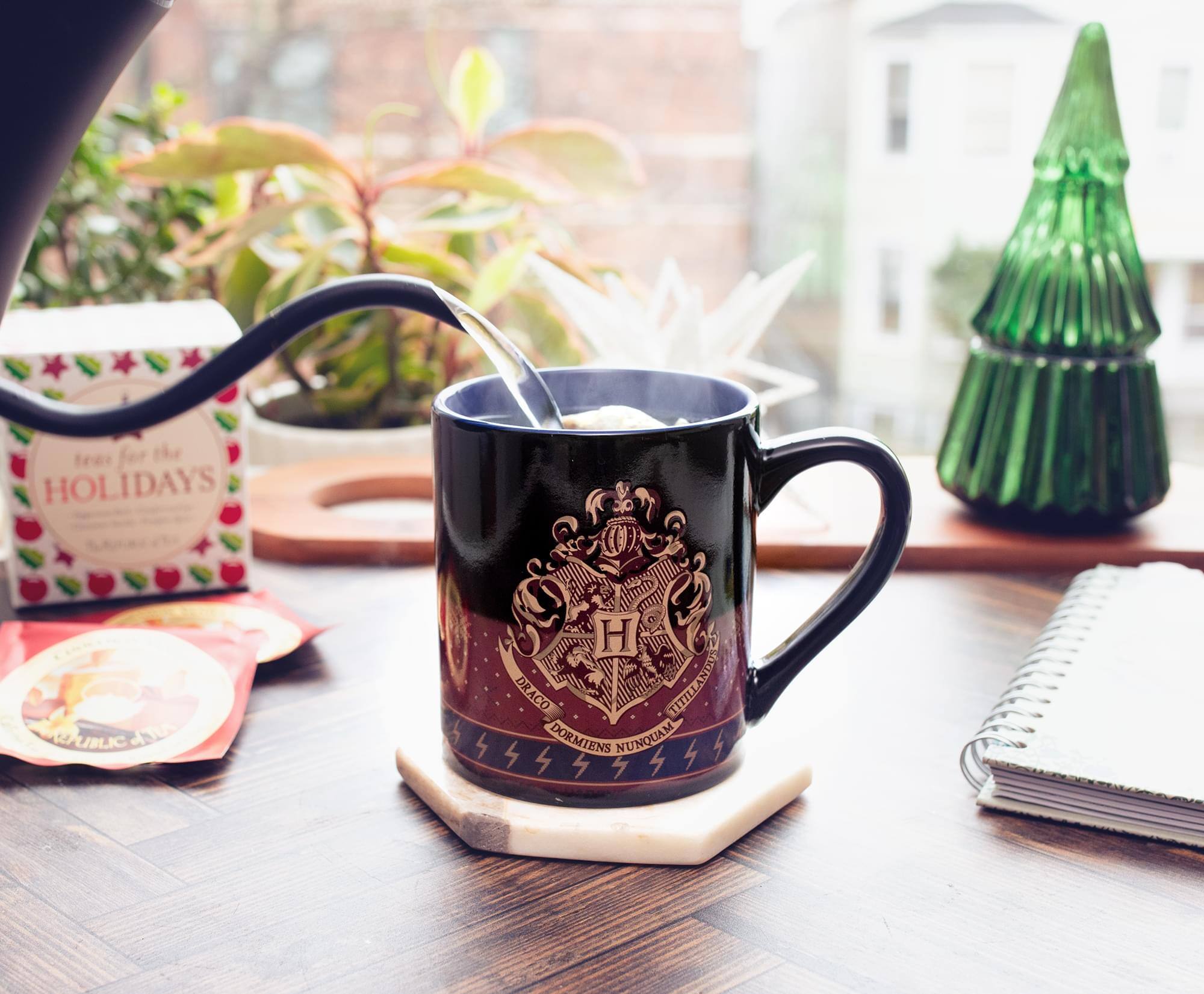 Sure, here is the corrected and grouped text from the image:

---

**Hogwarts**

**Hufflepuff**

**DRACO TITILLANDO TITILL DORMIENS NUNQUAM**

---

**Tea for the Holidays**

---

**Hogwarts**

**Hufflepuff**

**DRACO TITILLANDO TITILL DORMIENS NUNQUAM**

---

**Tea for the Holidays**

---