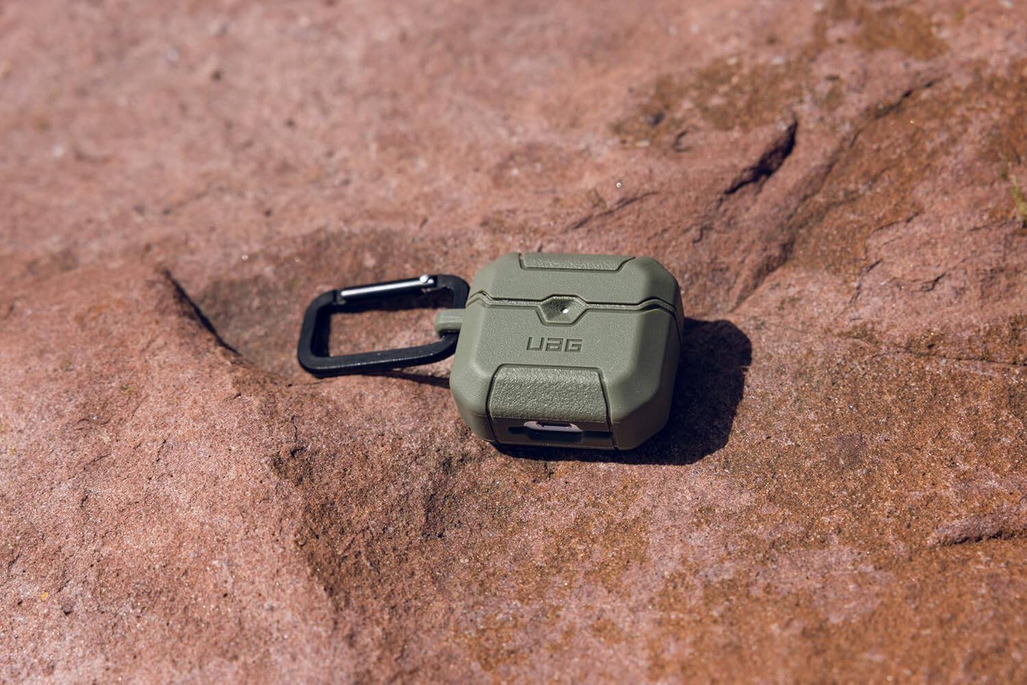 Left. UAG - UAG Designed for AirPods 4th Gen Case Scout, Rugged Military Grade Drop Proof Protective Cover with Detachable Carabiner - Rust.