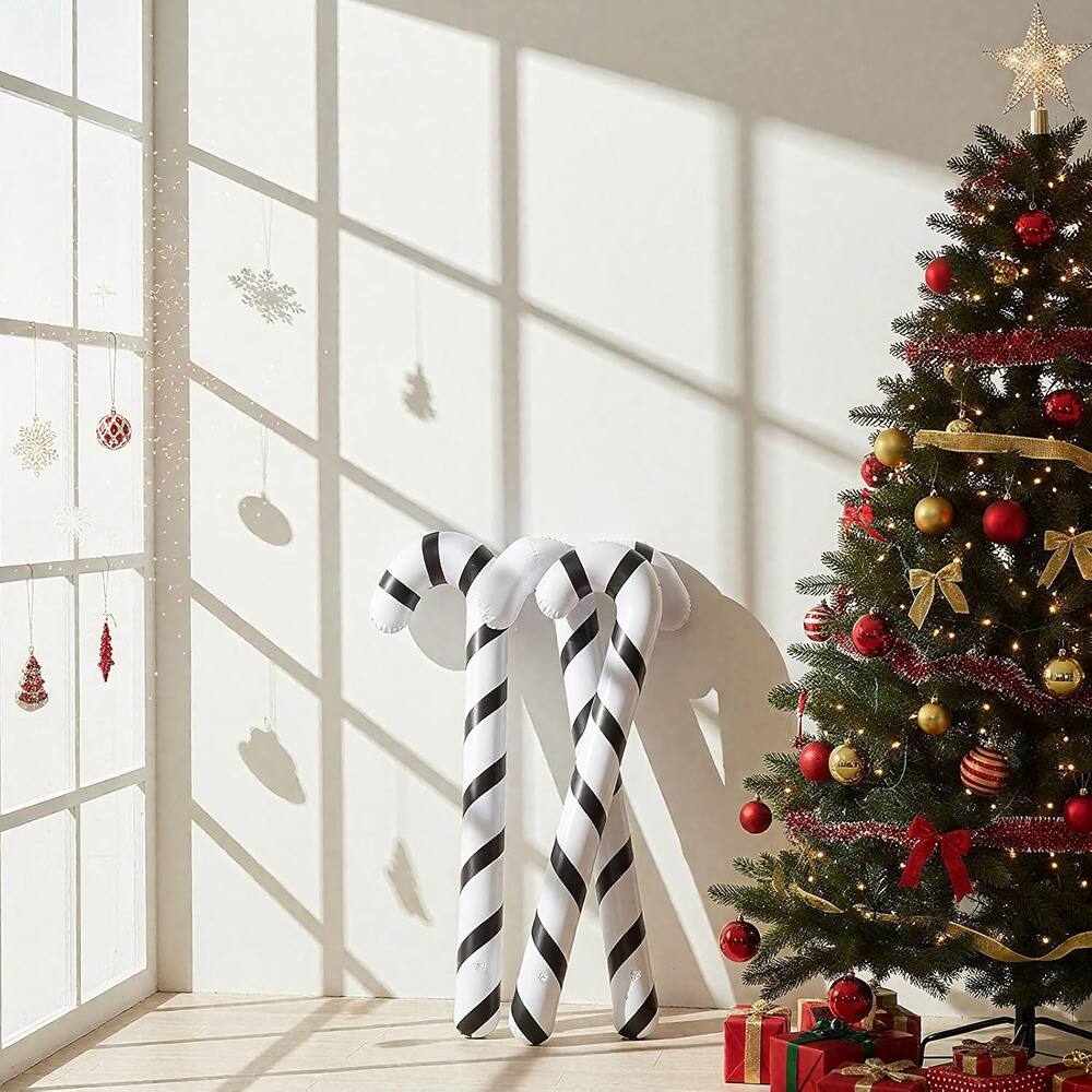 Left. PARKER SLATER - 2-Pc 35in Inflatable Candy Canes – Black & White Indoor/Outdoor Decor - White, Black.