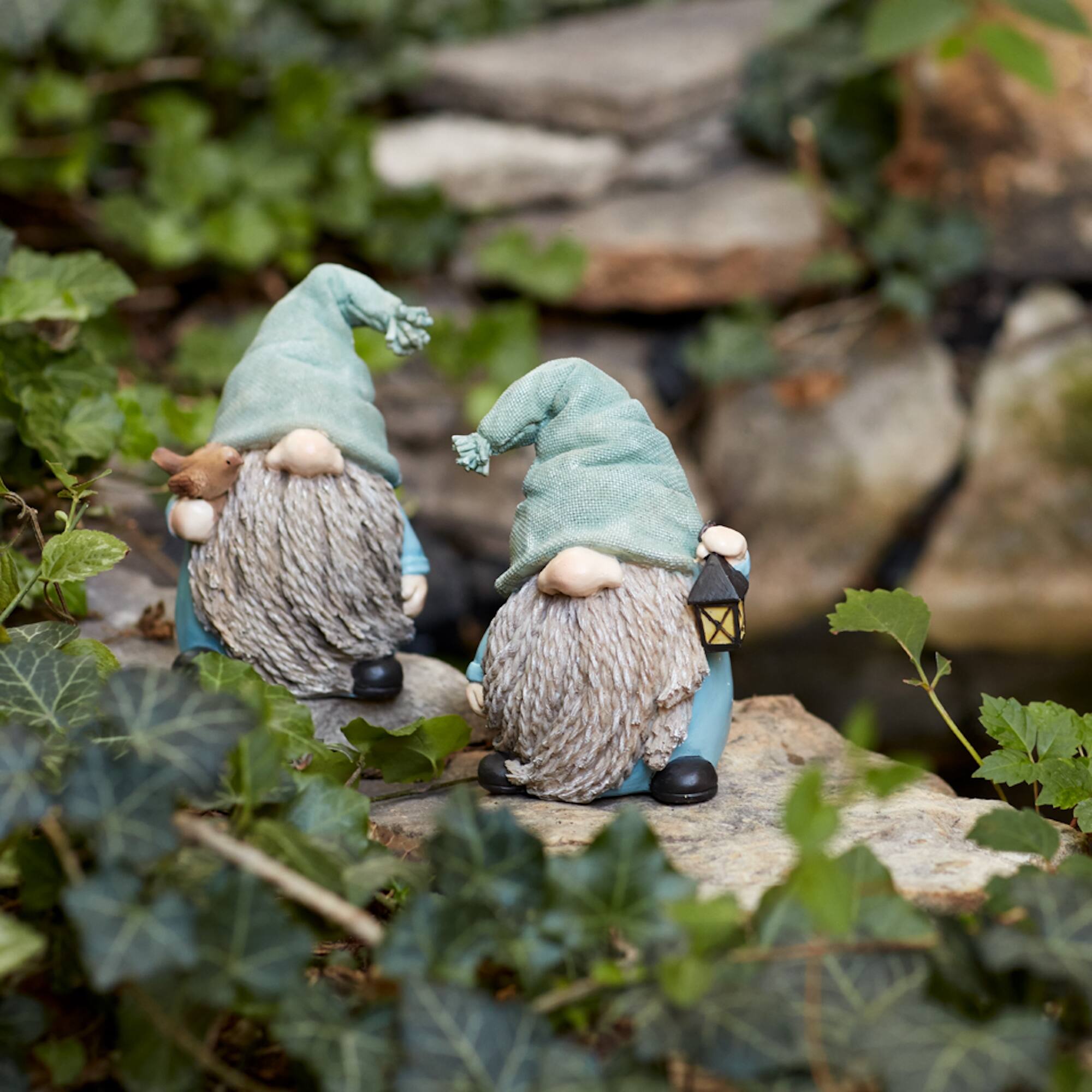 Angle. BreeBe - Stone Garden Gnome Figurine with Bird and Lantern Accent (Set of 4) - Green.