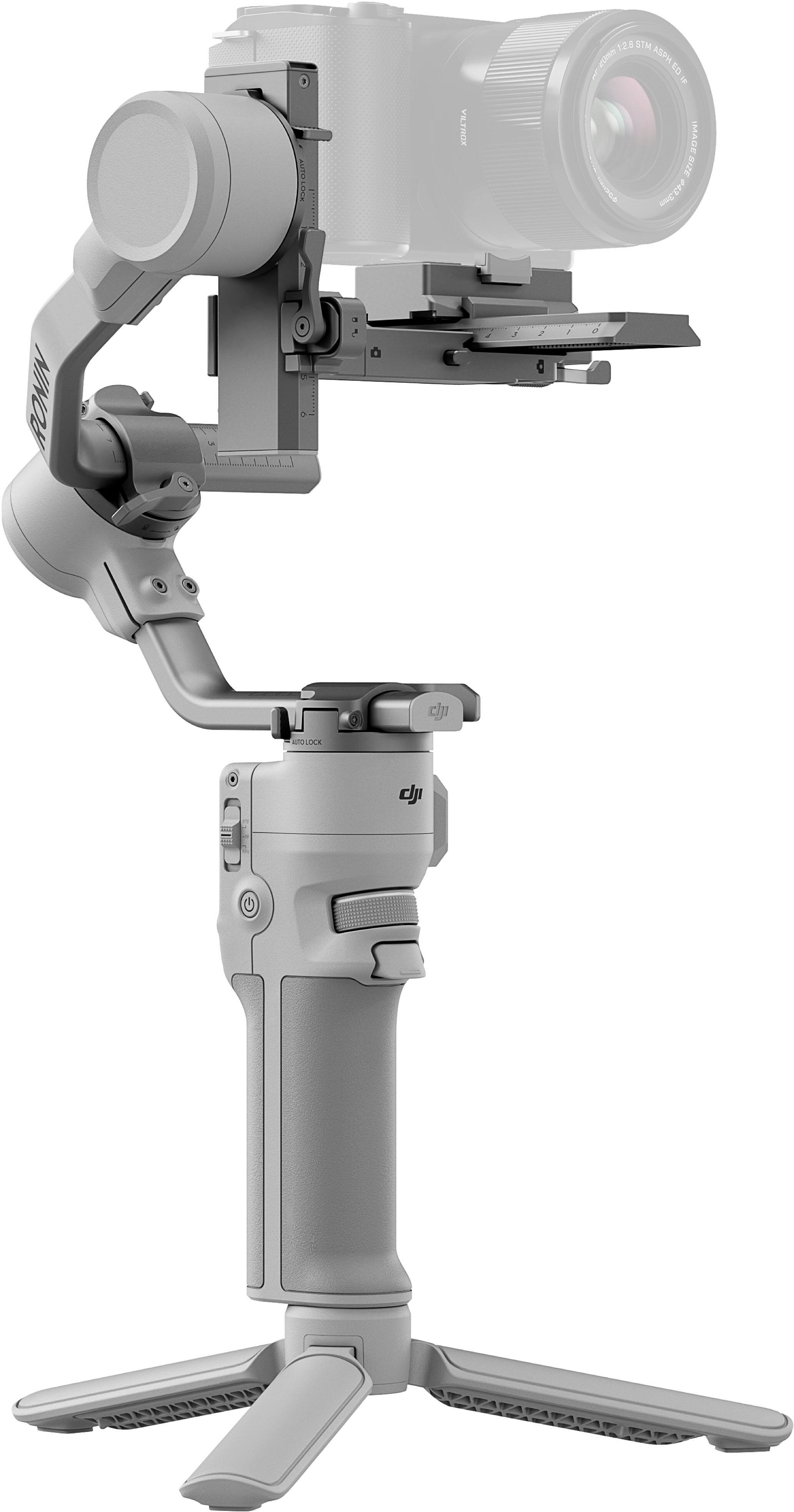 The image features a camera stand, which is a part of a camera system. The stand is designed to hold a camera in place and provide stability for the device. The stand is made of metal and has a sturdy construction, ensuring that the camera remains securely in place. The stand is also equipped with a locking mechanism to prevent the camera from accidentally falling or being moved.
