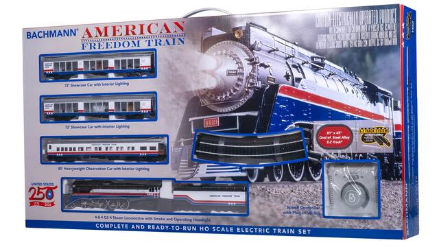 BACHMANN AMERICAN FREEDOM TRAIN
- 72' Showcase Car with Interior Lighting
- 72' Showcase Car with Interior Lighting
- 85' Heavyweight Observation Car with Interior Lighting
- 4-8-4 GS-4 Steam Locomotive with Smoke and Operating Headlight
- Speed Controller with Plug-In Wiring
COMPLETE AND READY-TO-RUN HO SCALE ELECTRIC TRAIN SET
UNITED STATES 250 LEAS AMERICAN FREEDOM TRAIN
1776 - 2026
ELECTRICALLY OPERATED PRODUCT
- 45" Oval of Steel Alloy E-Z Track
- E-Z TRACK SYSTEM
KRK